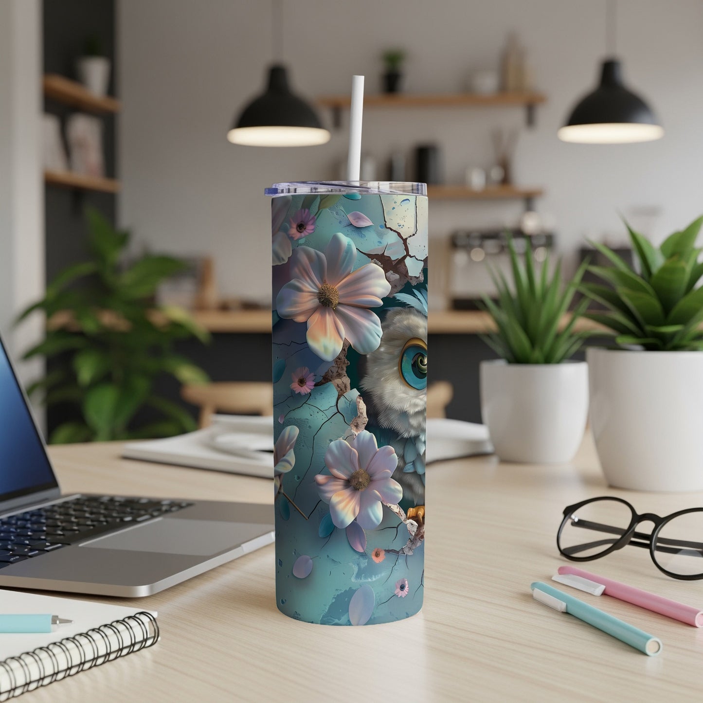 Teal tumbler with cracked pattern and floral owl illustration.