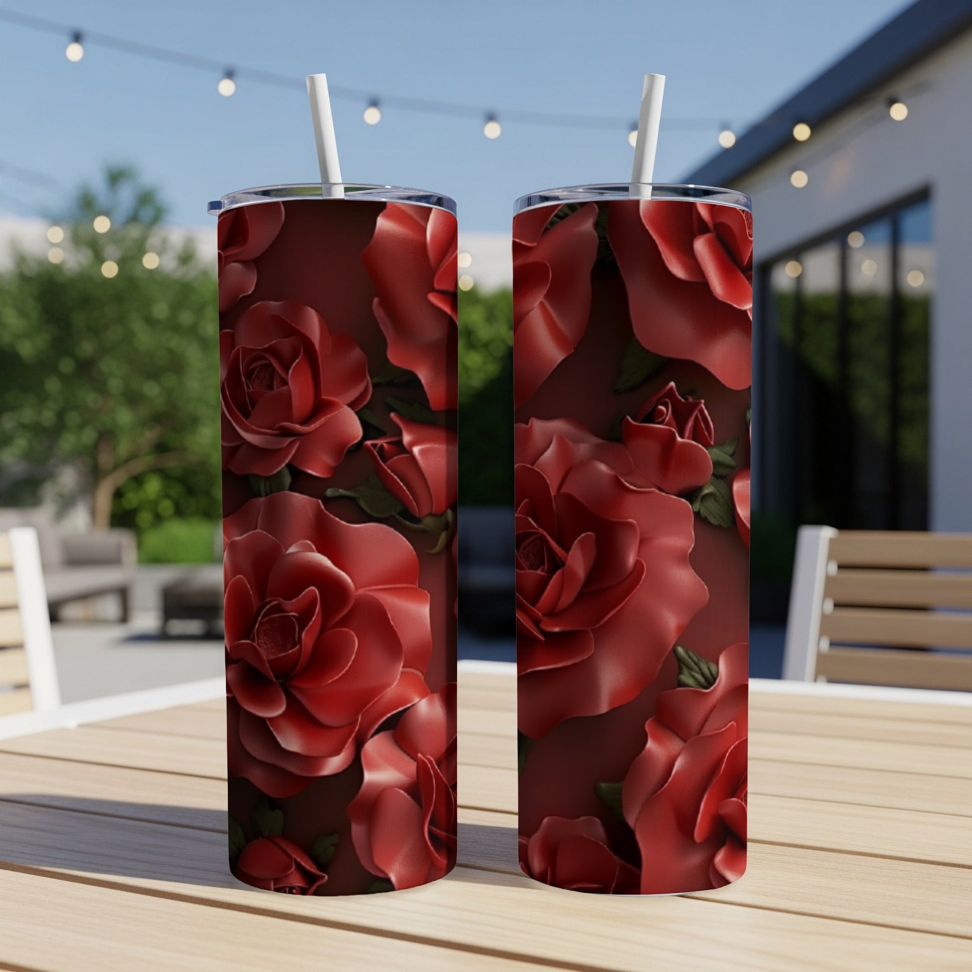 Two tall tumblers with a red rose floral pattern.