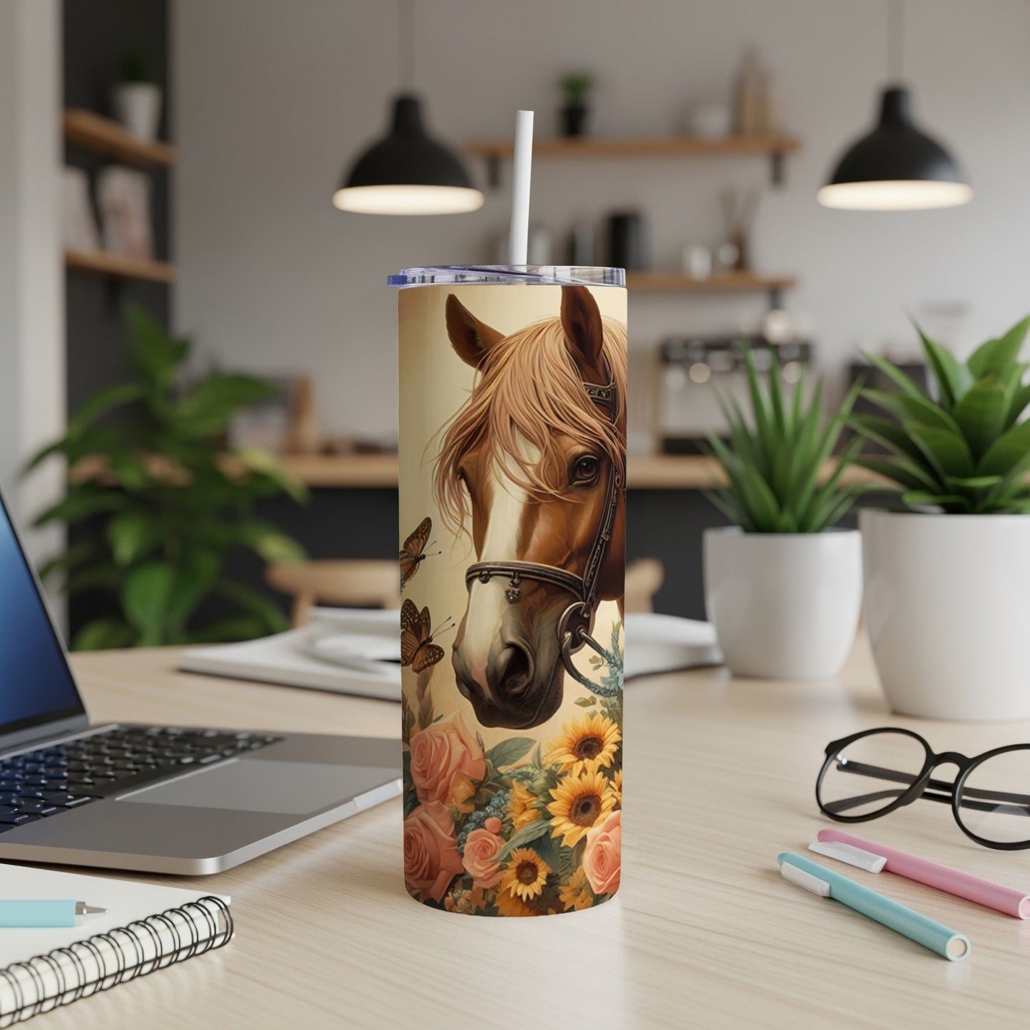 Horse and floral illustration on a tall tumbler with straw.