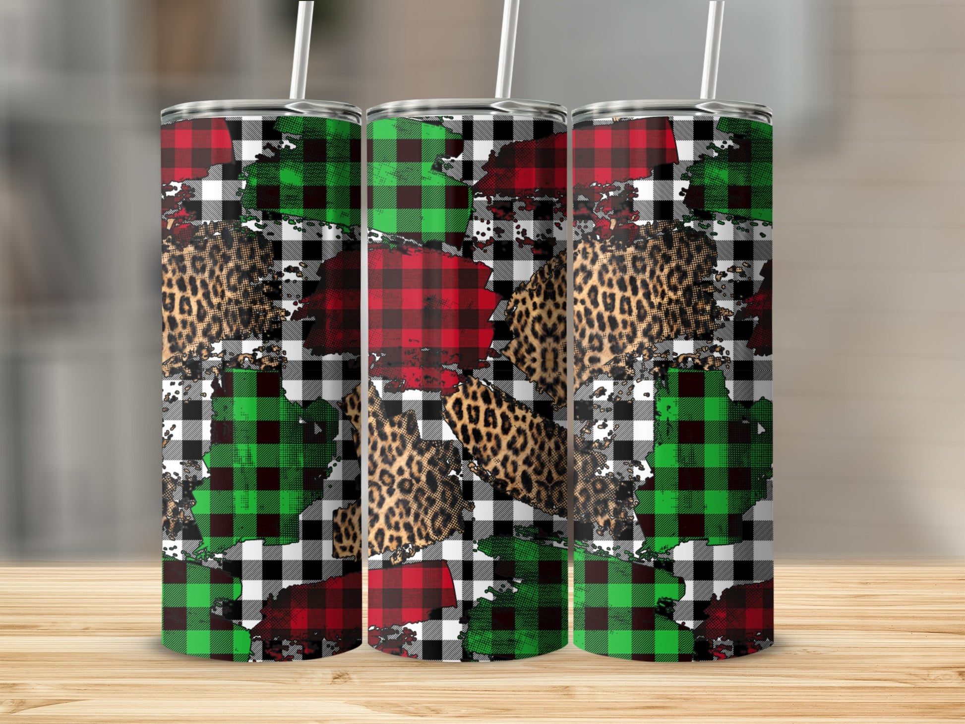 Three tumblers with buffalo plaid and leopard print designs.