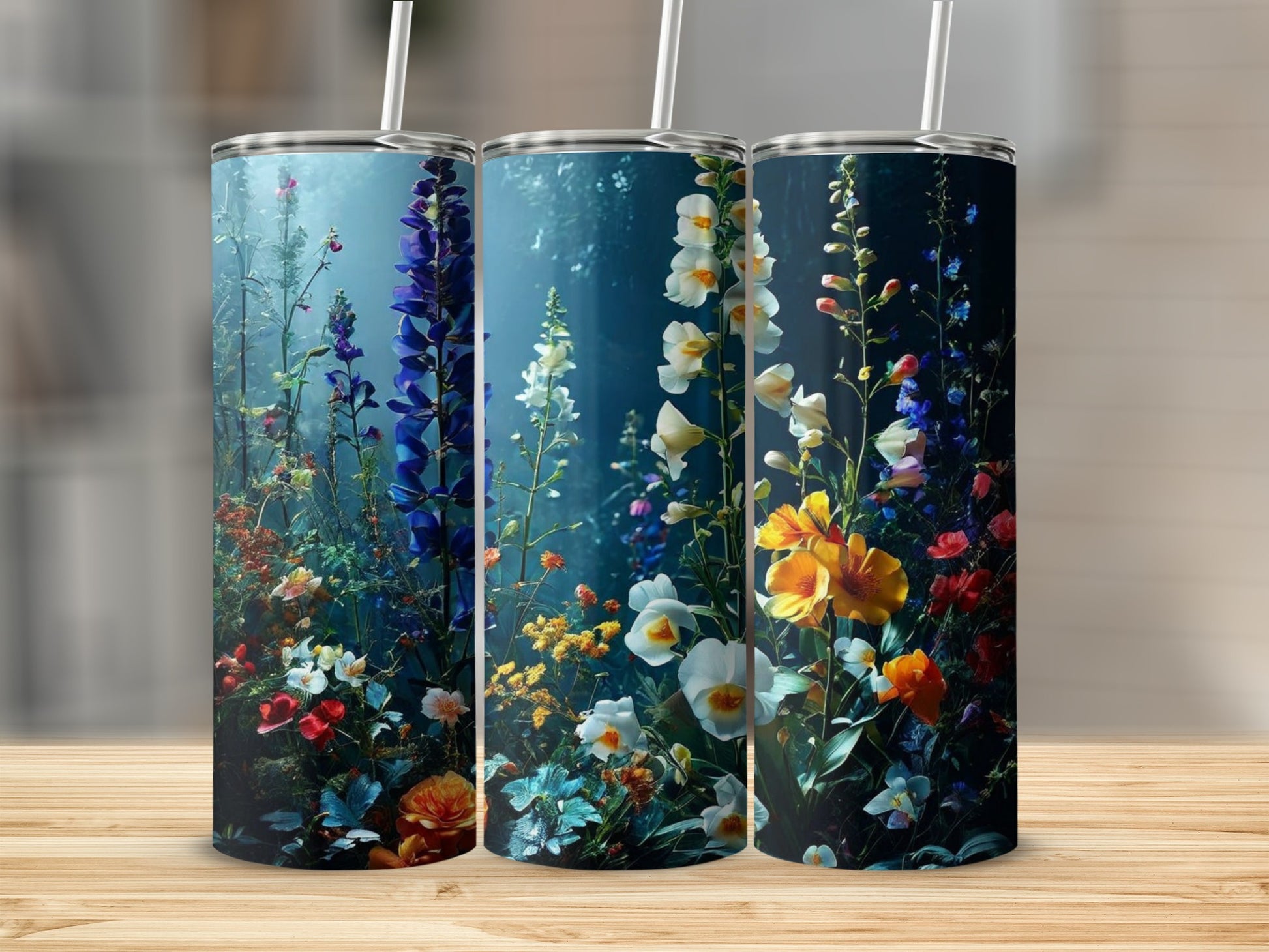 Three tall tumblers decorated with a vibrant, dark floral design.