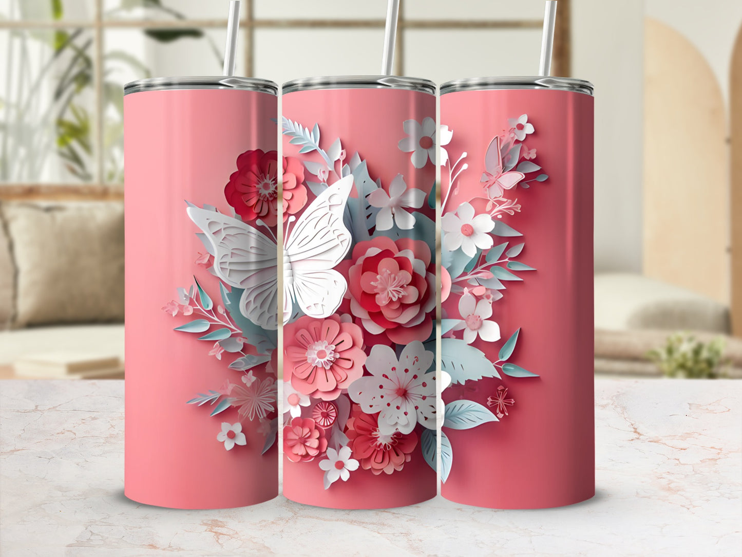 Three pink tumblers with floral butterfly designs and white lids.