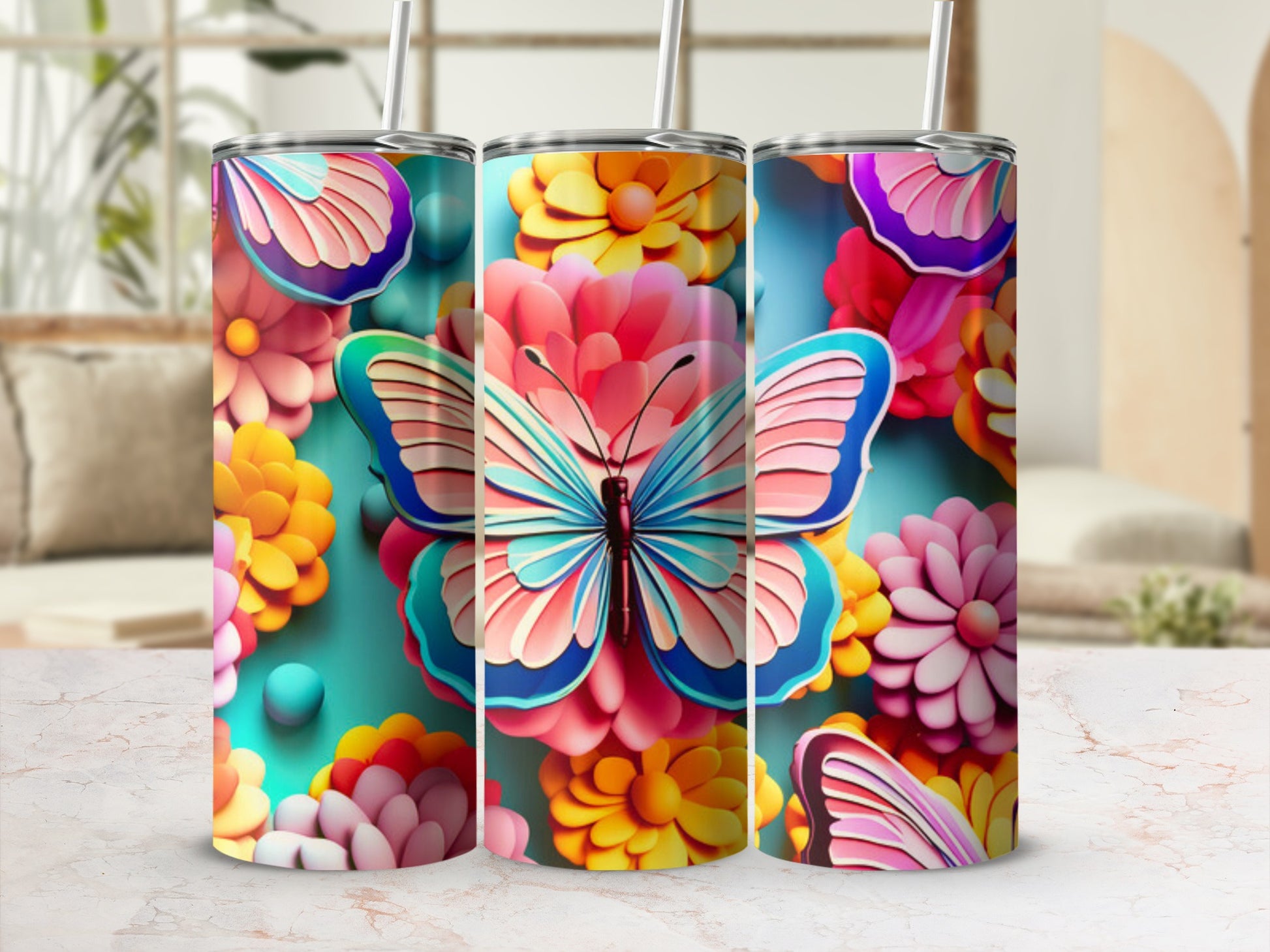 Butterfly and floral pattern on a 3-pack of skinny tumblers.