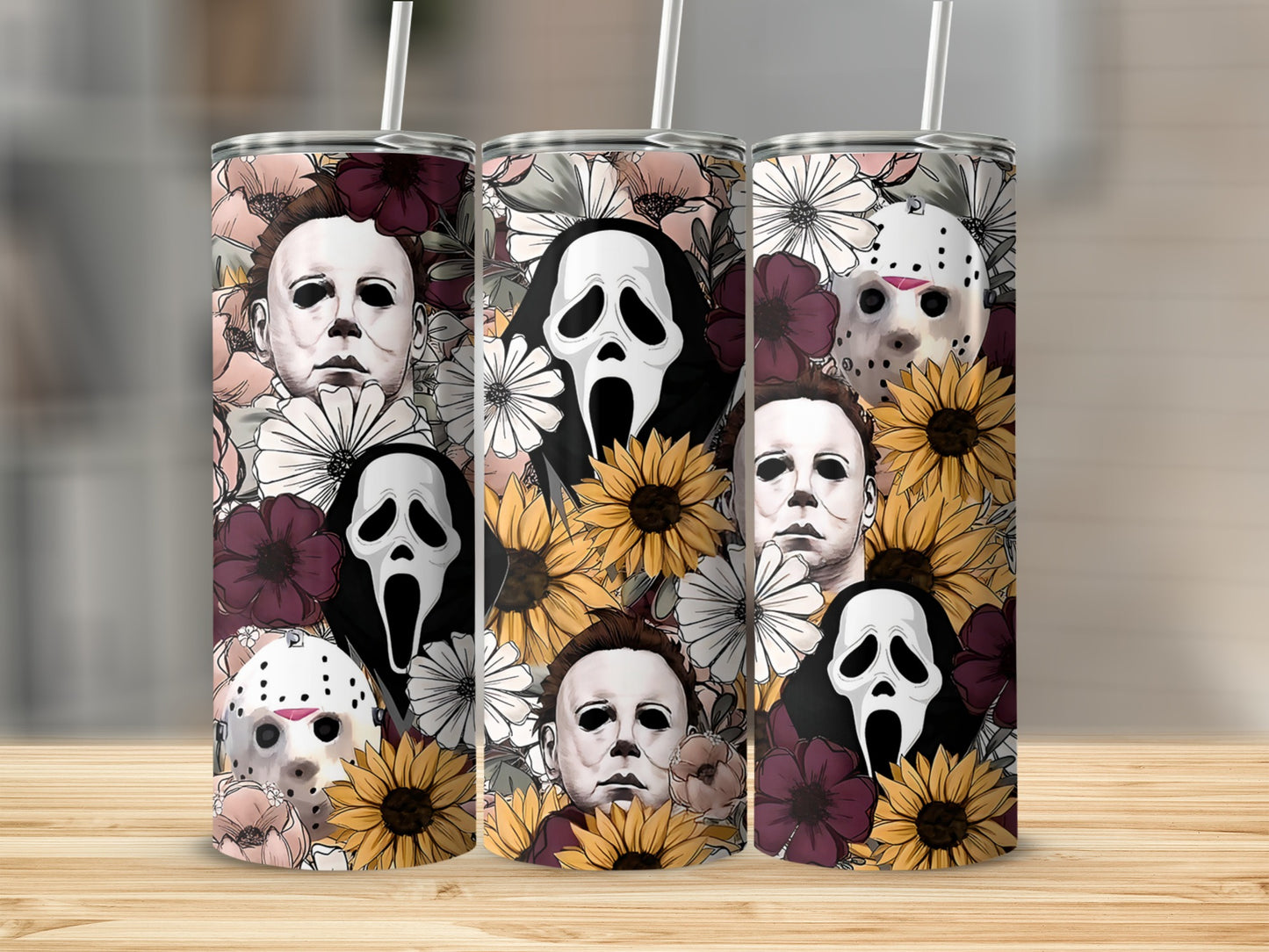 Three tumblers with horror movie villains and floral patterns.