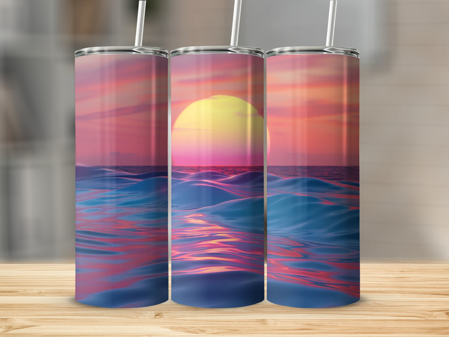 Three tumblers displaying a sunset over choppy ocean waves.
