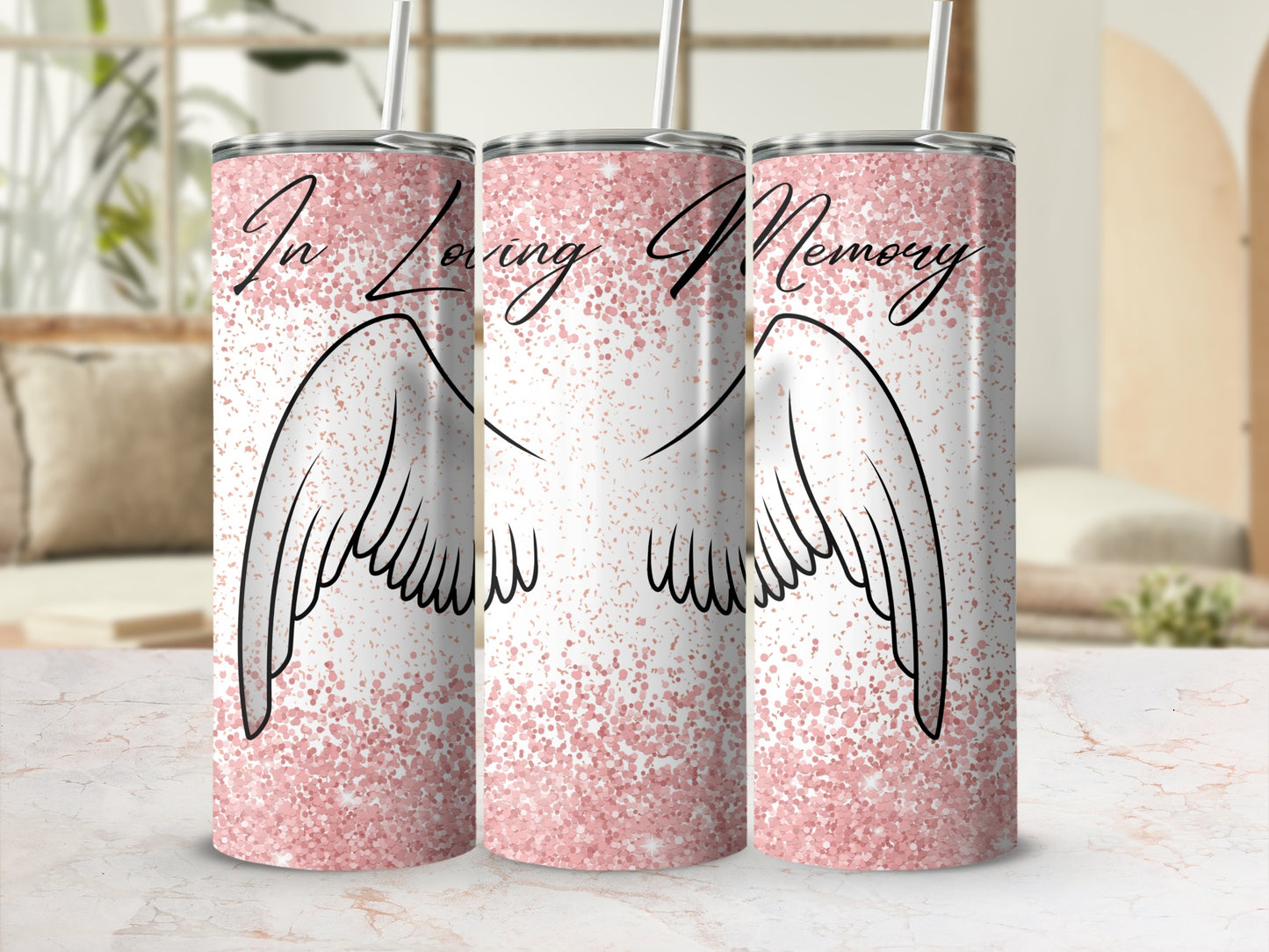 "In Loving Memory" text on a pink glittery tumbler with angel wings.