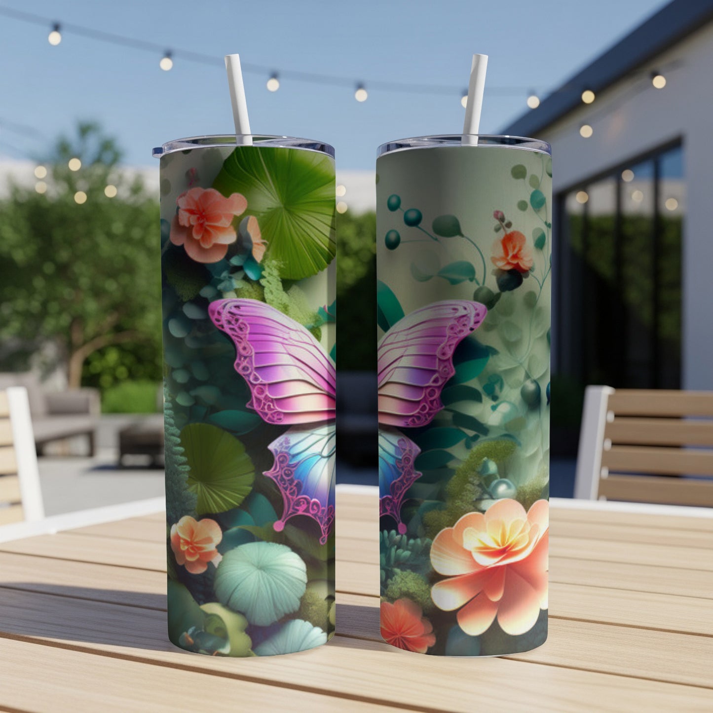 Two tumblers with colorful butterfly and floral designs on a table.
