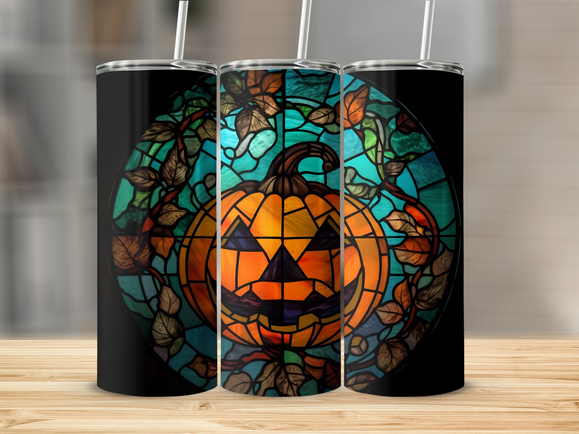 Stained glass jack-o'-lantern with autumn leaves on a tumbler.