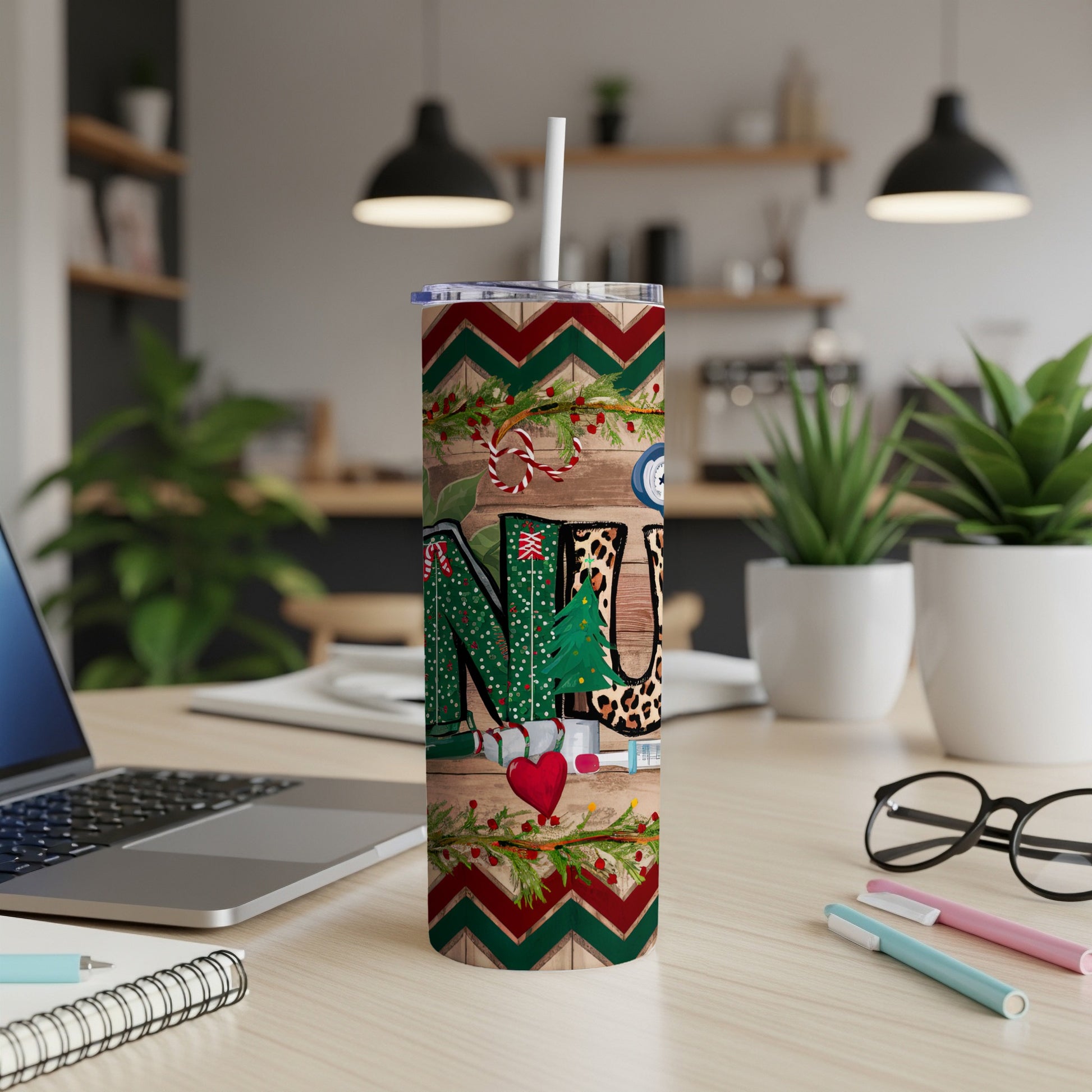 Christmas-themed tumbler with "NURSE" and medical icons on wooden background.