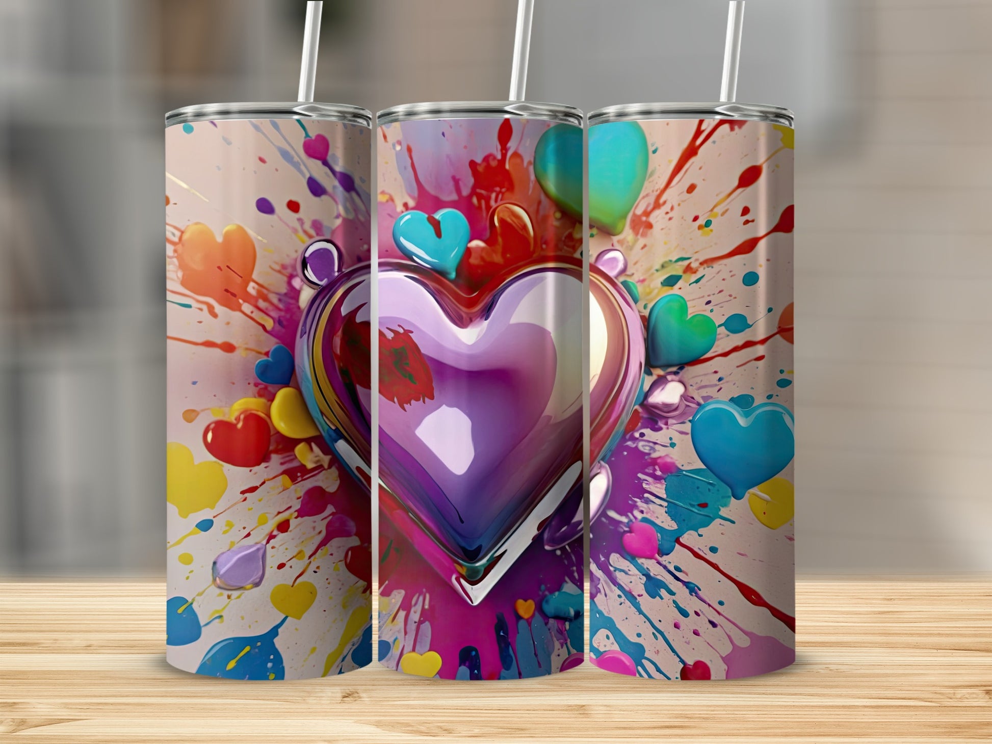 Tumbler with colorful heart and paint splatter design.