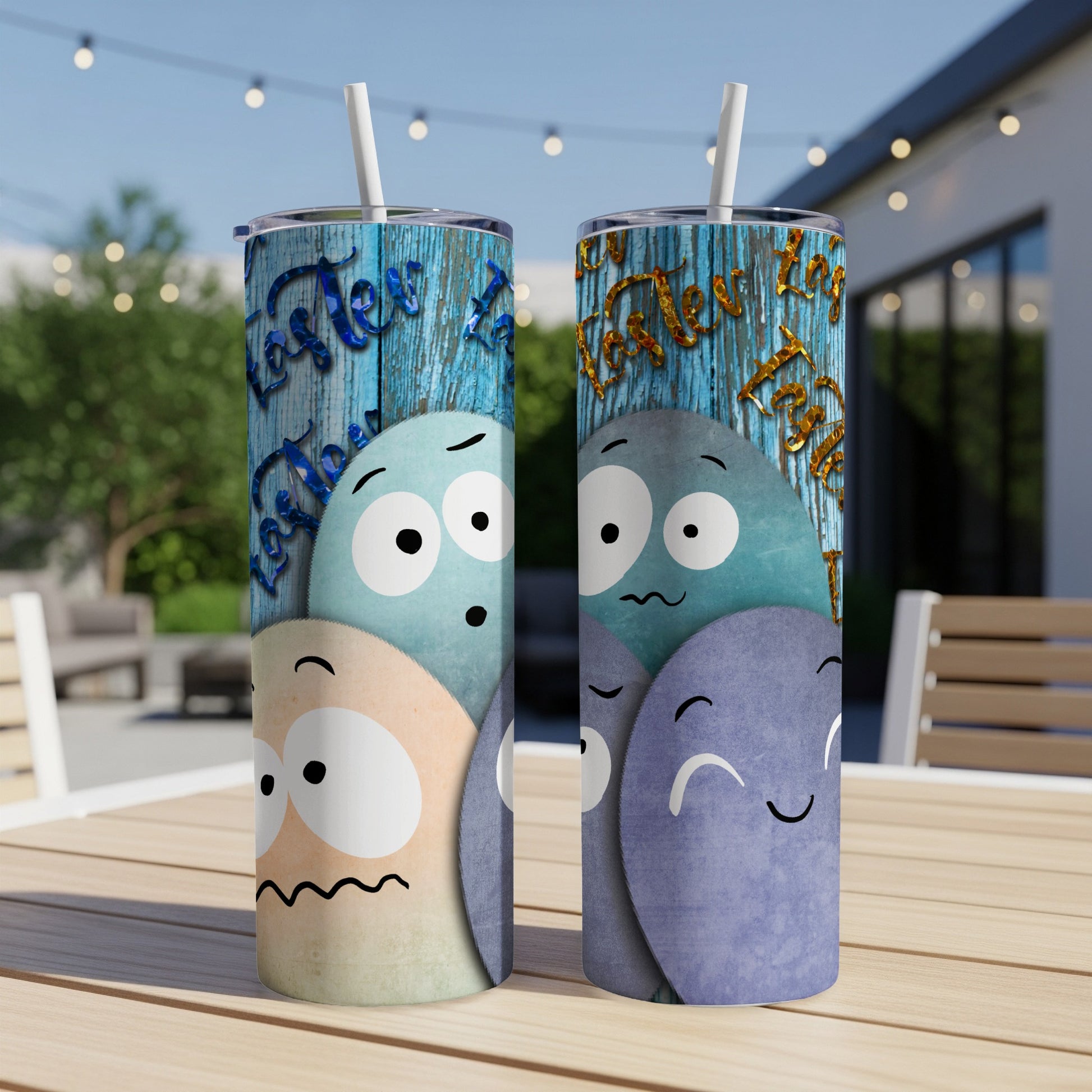 Two tumblers with cartoon Easter eggs and blue wood texture background.
