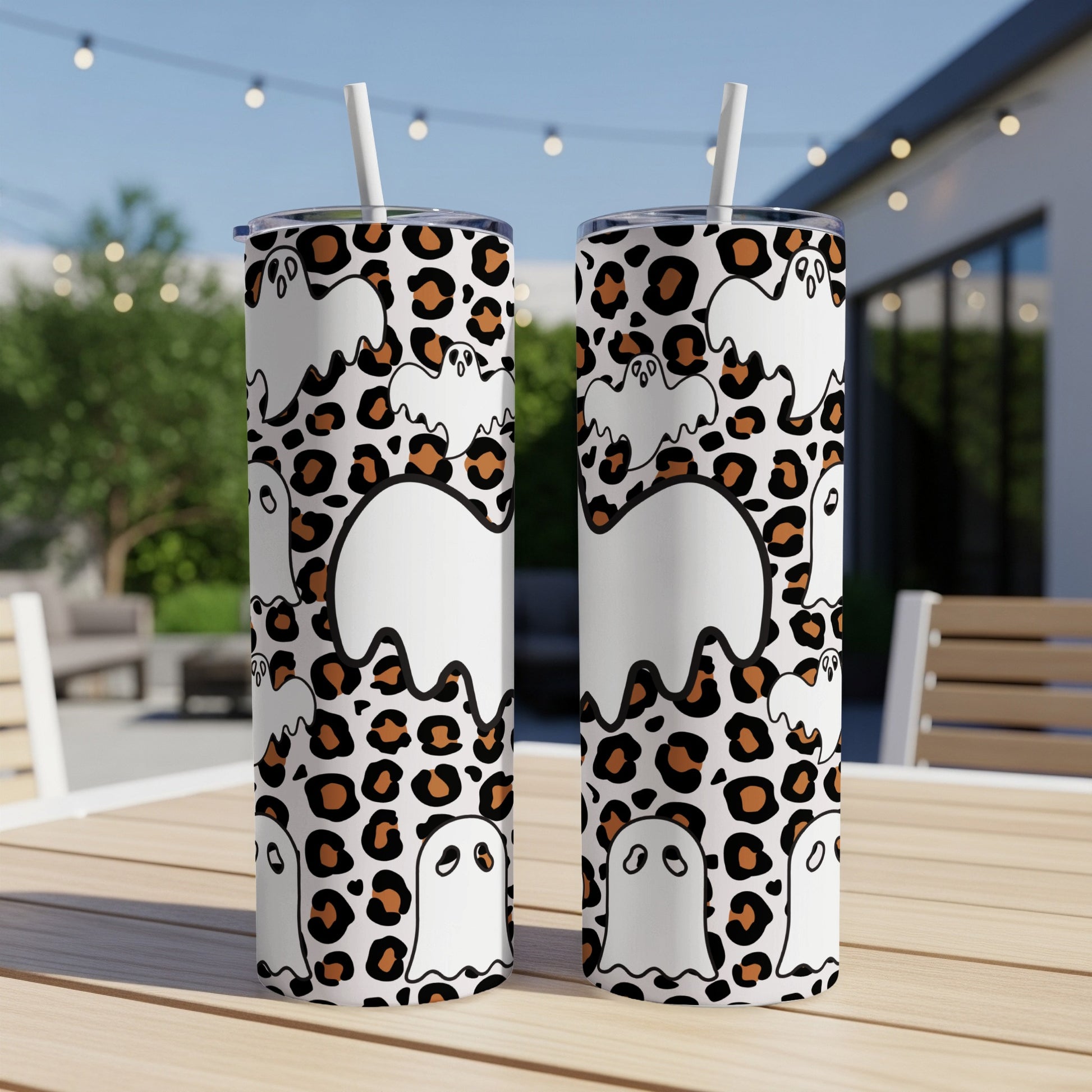 Two tumblers with white ghosts and leopard print design.