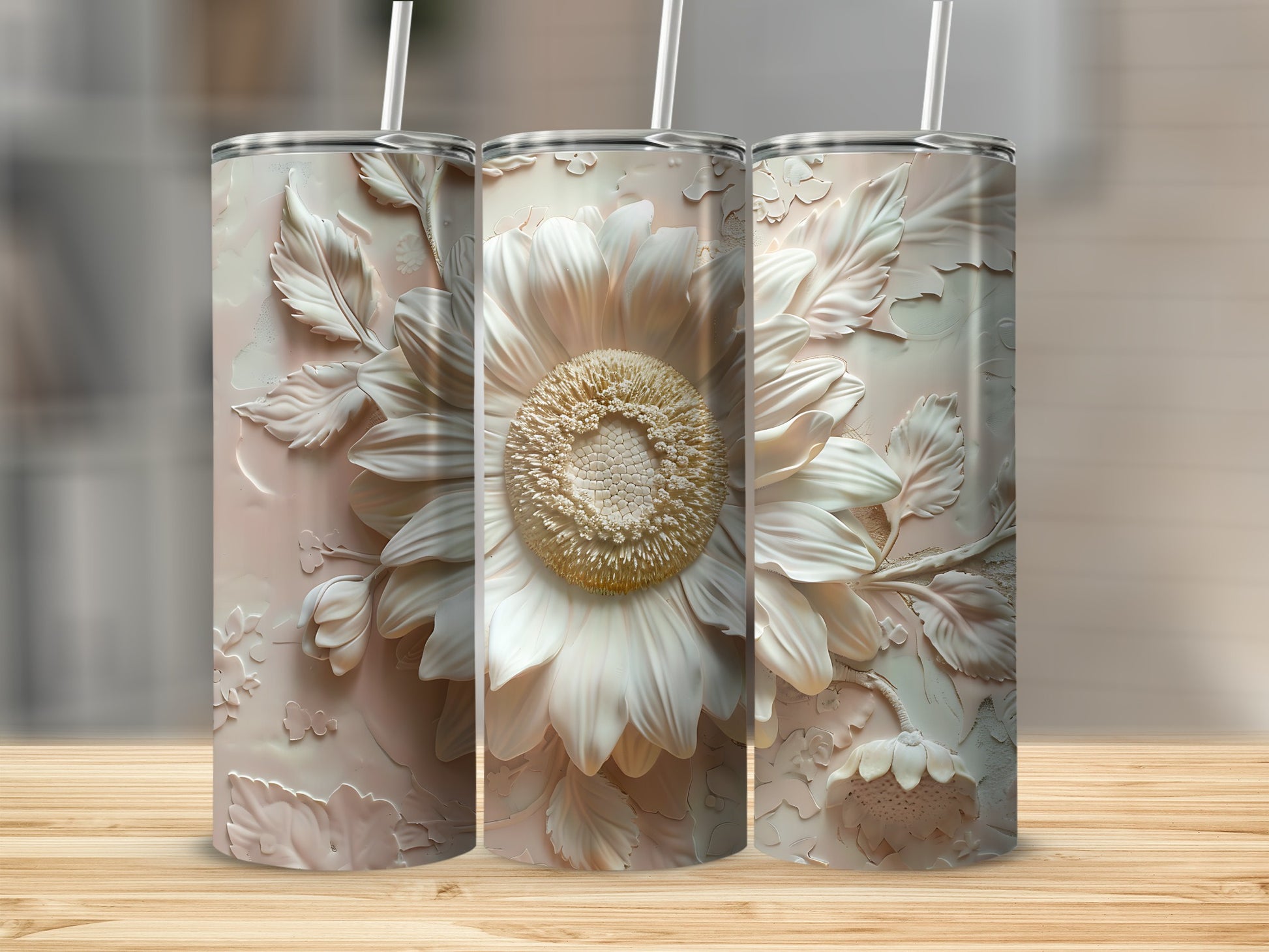 Three pastel tumblers featuring a detailed embossed sunflower design.