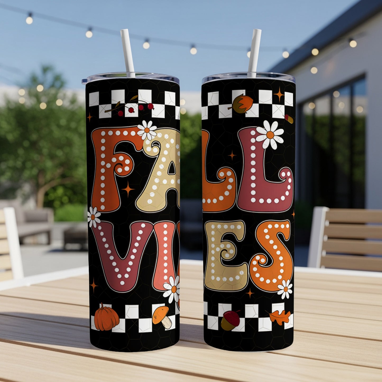 Black tumbler with "Fall Vibes" text and autumn motifs.