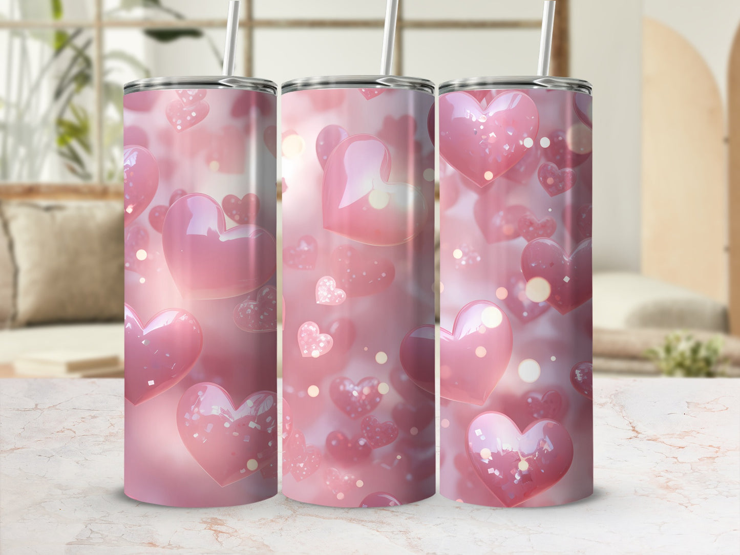Pink heart pattern on three tumblers with straws.
