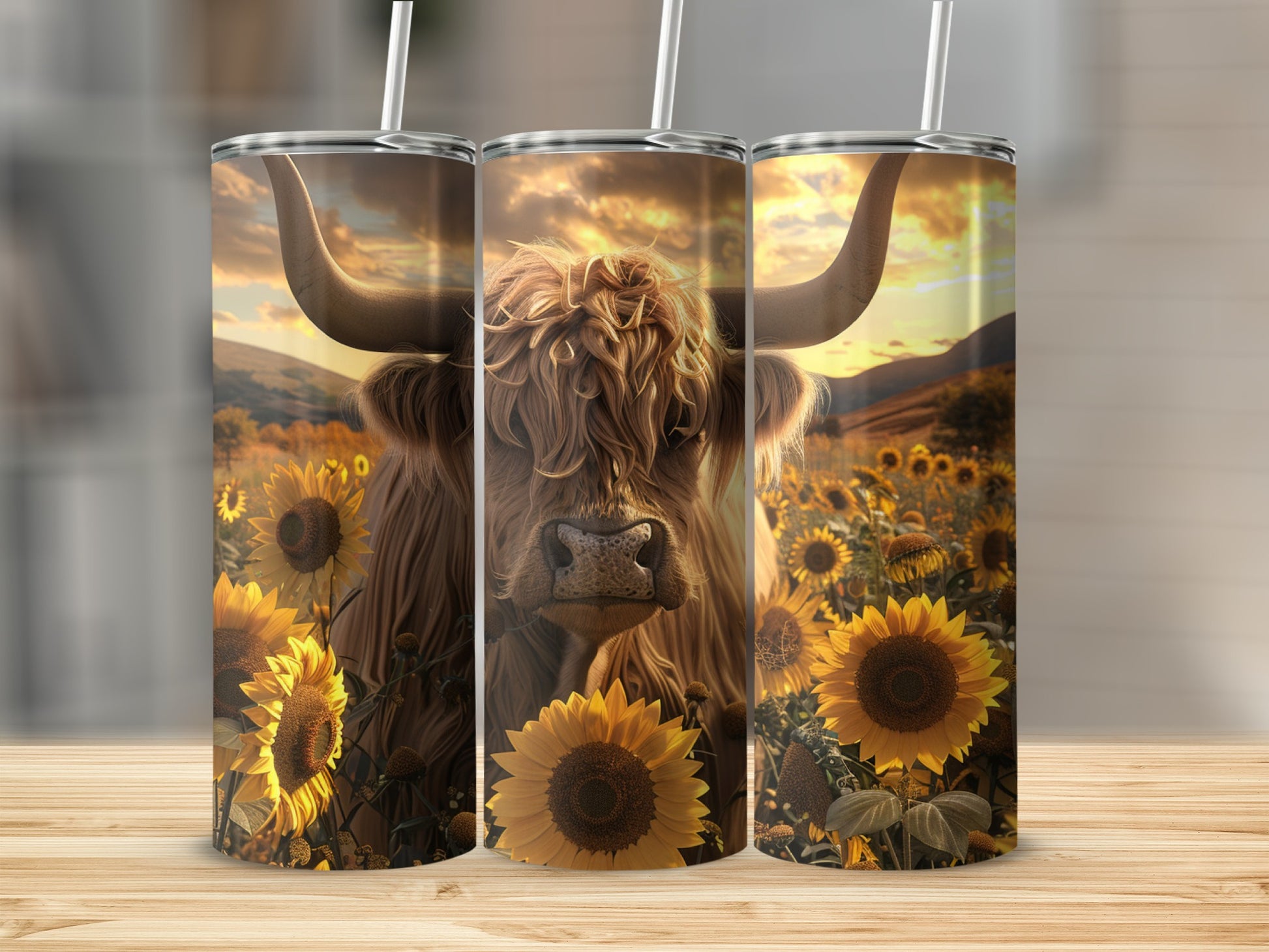 Three tumblers featuring a Highland cow in a sunflower field.