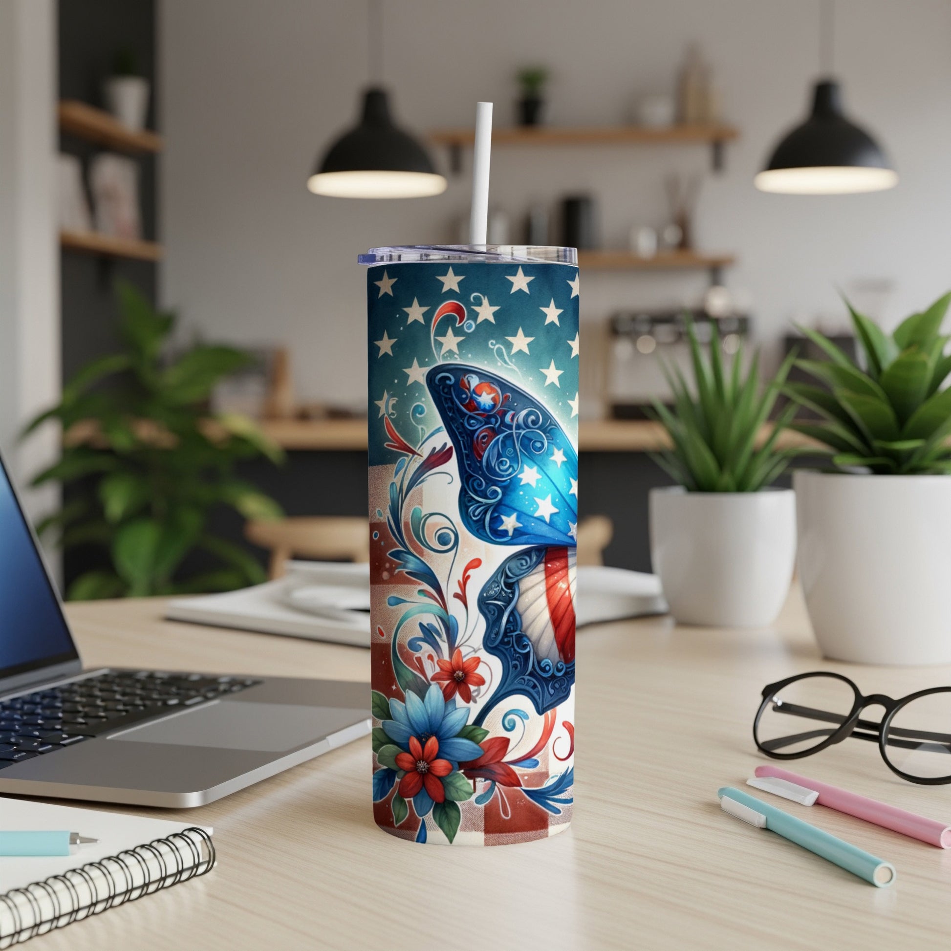 Tumbler with patriotic American flag design, stars, and floral accents.