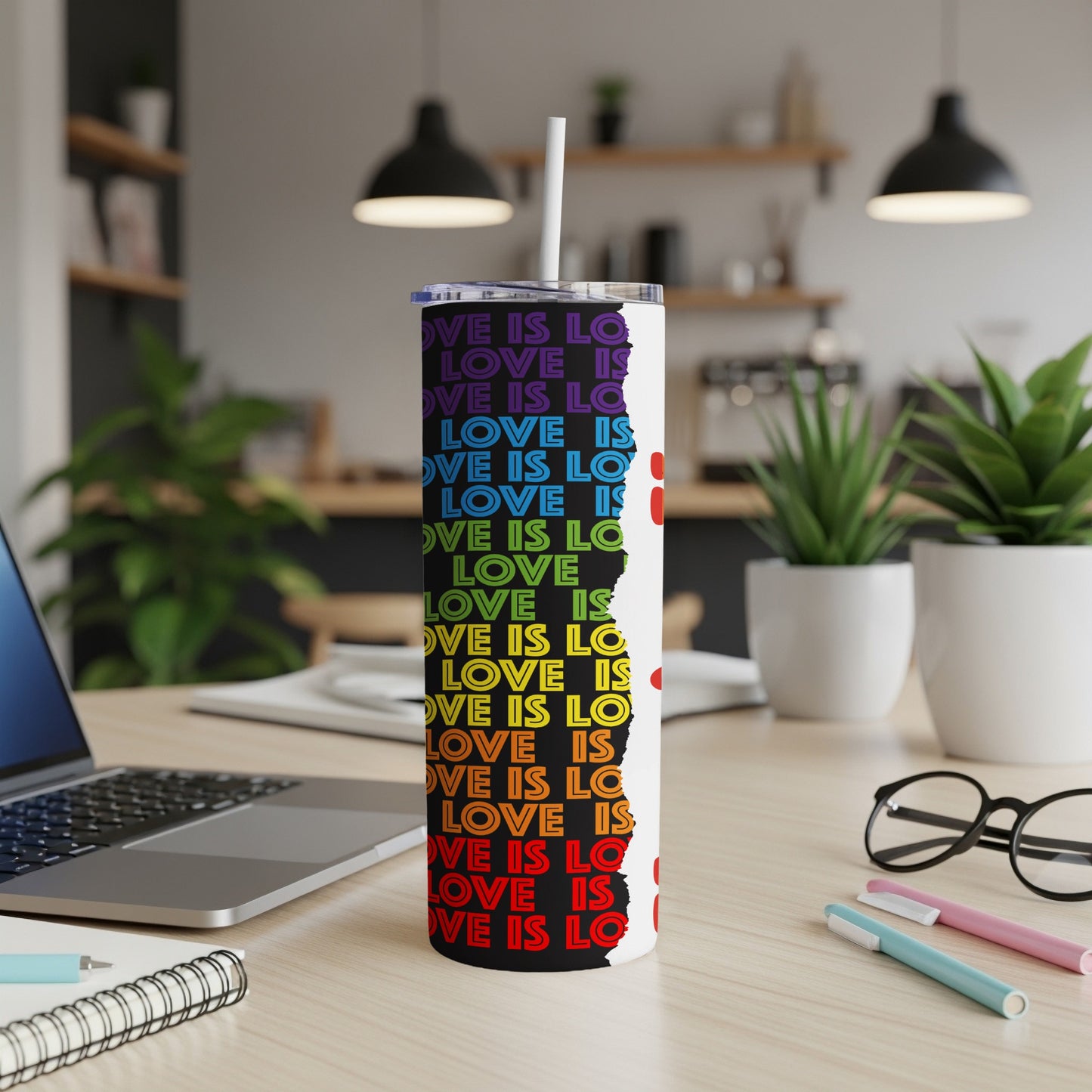Rainbow gradient tumbler with "LOVE IS LOVE" repeated vertically.