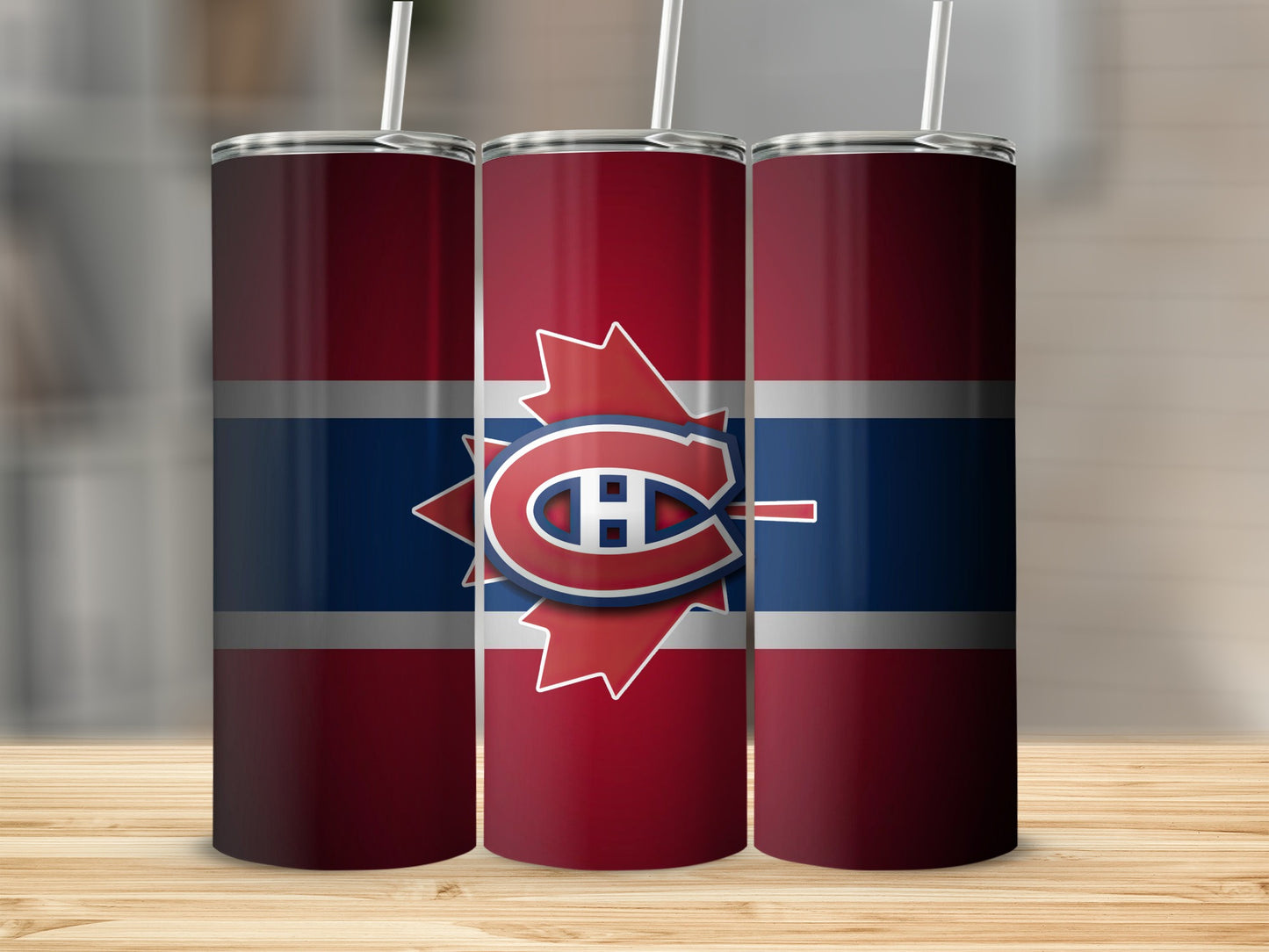 Three tumblers with Montreal Canadiens logo and colors on a wooden surface.