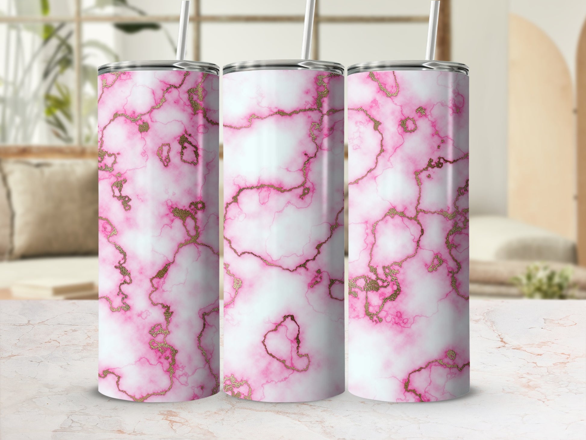 Three tumblers with pink and gold marble pattern.