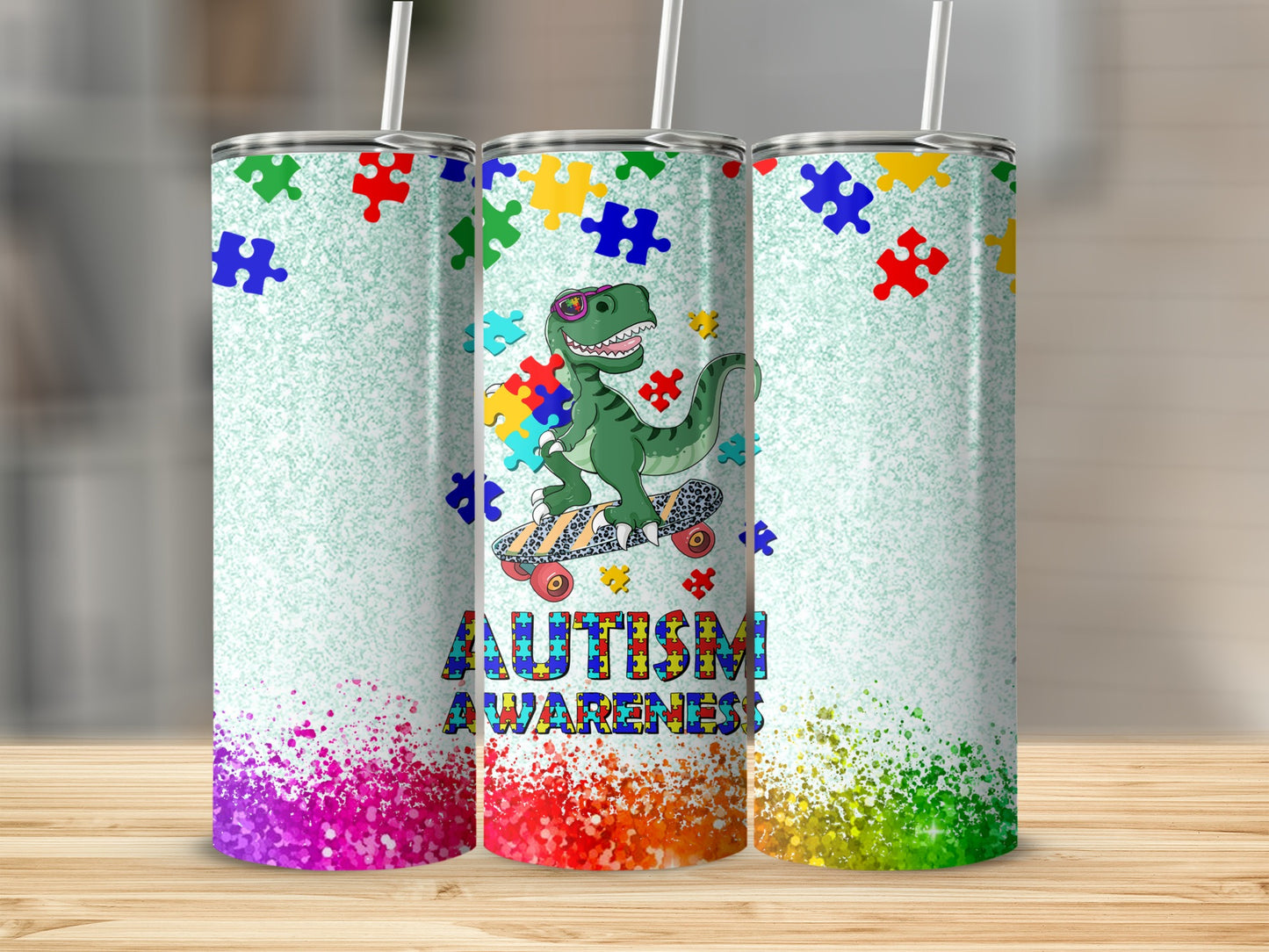Autism awareness dinosaur tumbler with colorful puzzle pieces and paint splatters.