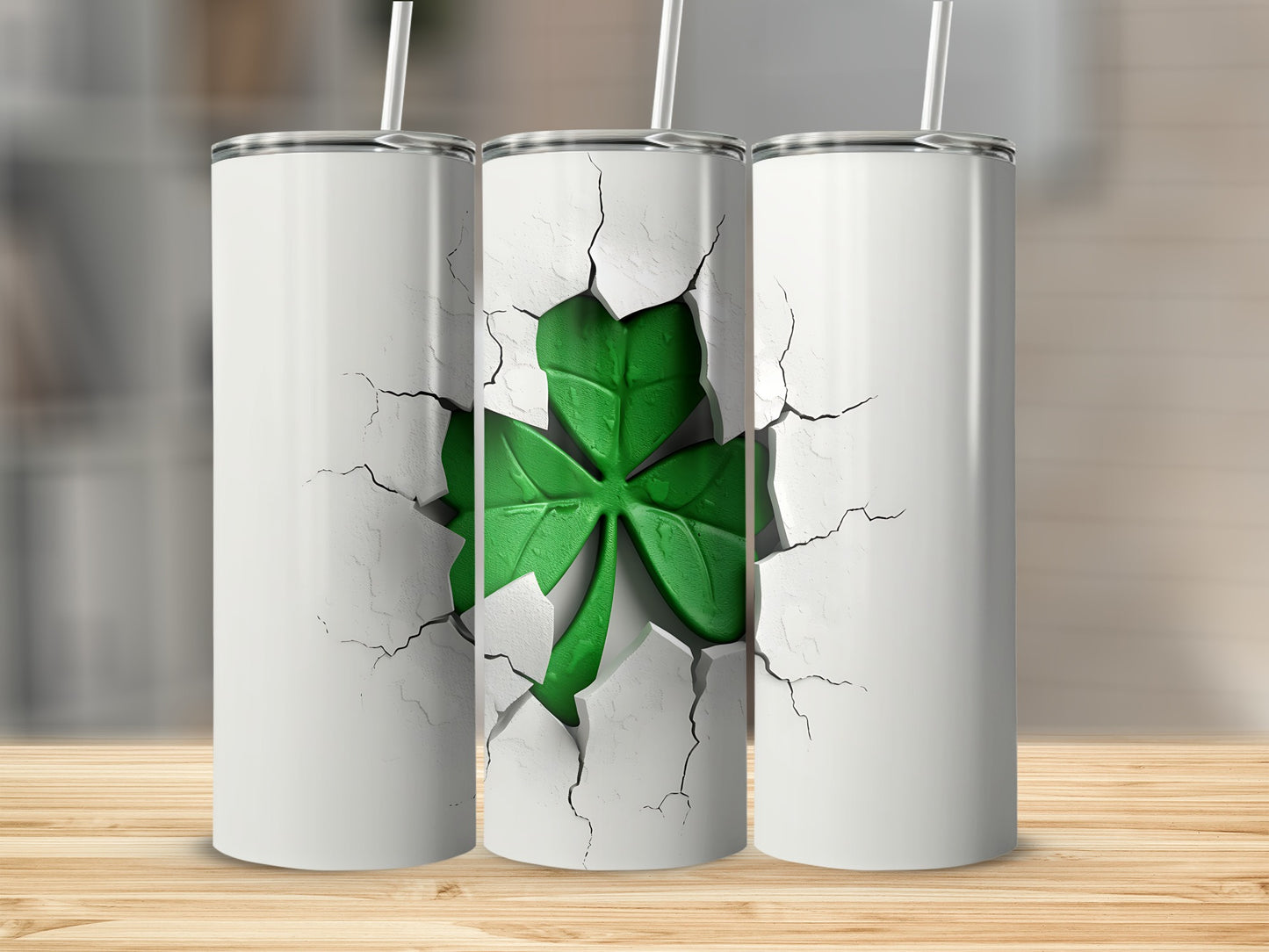 Three white tumblers with a cracked surface revealing a green shamrock.
