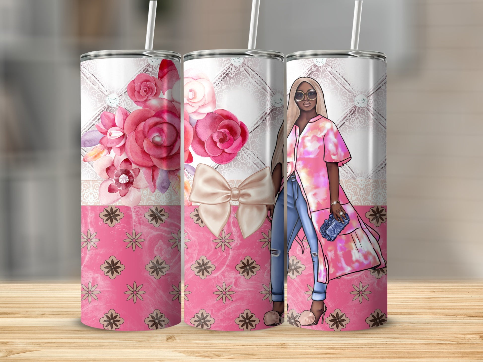Pink floral tumbler with illustrated woman in stylish outfit and jeans.