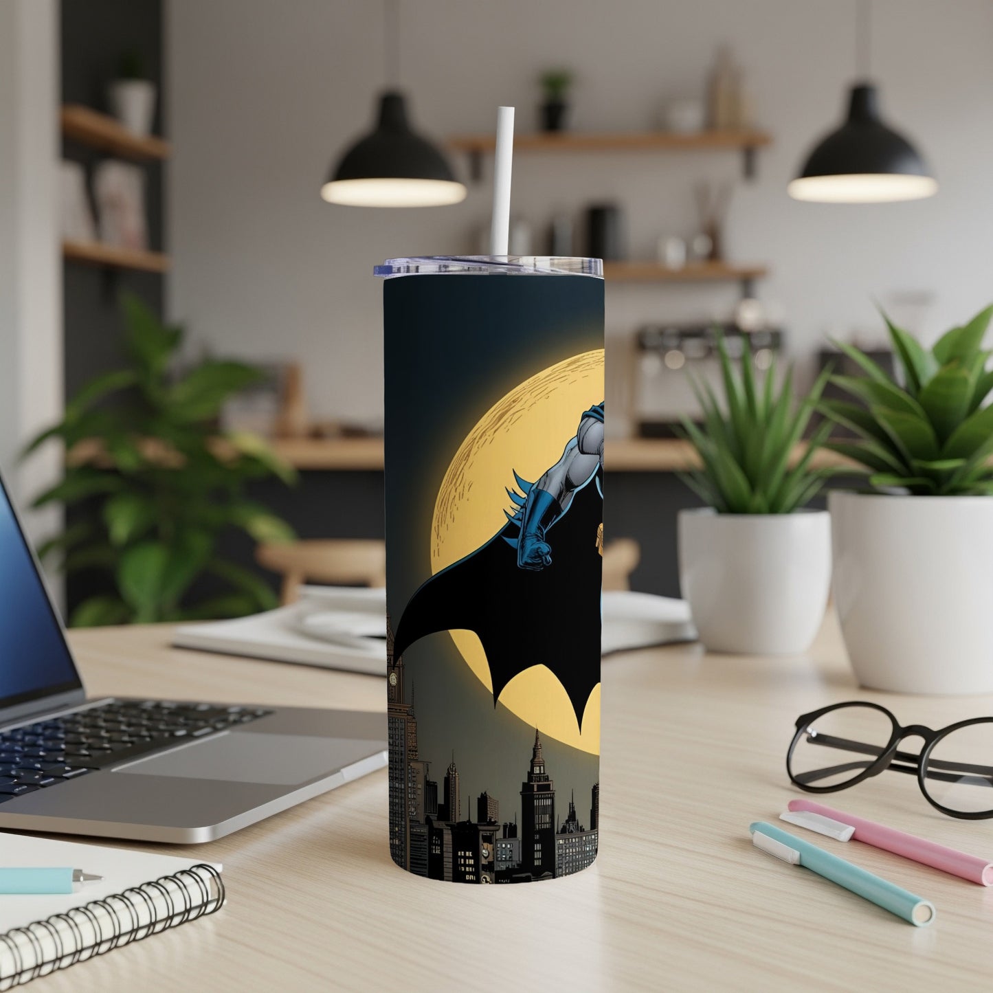 Batman silhouette against moon and city skyline on a tumbler.