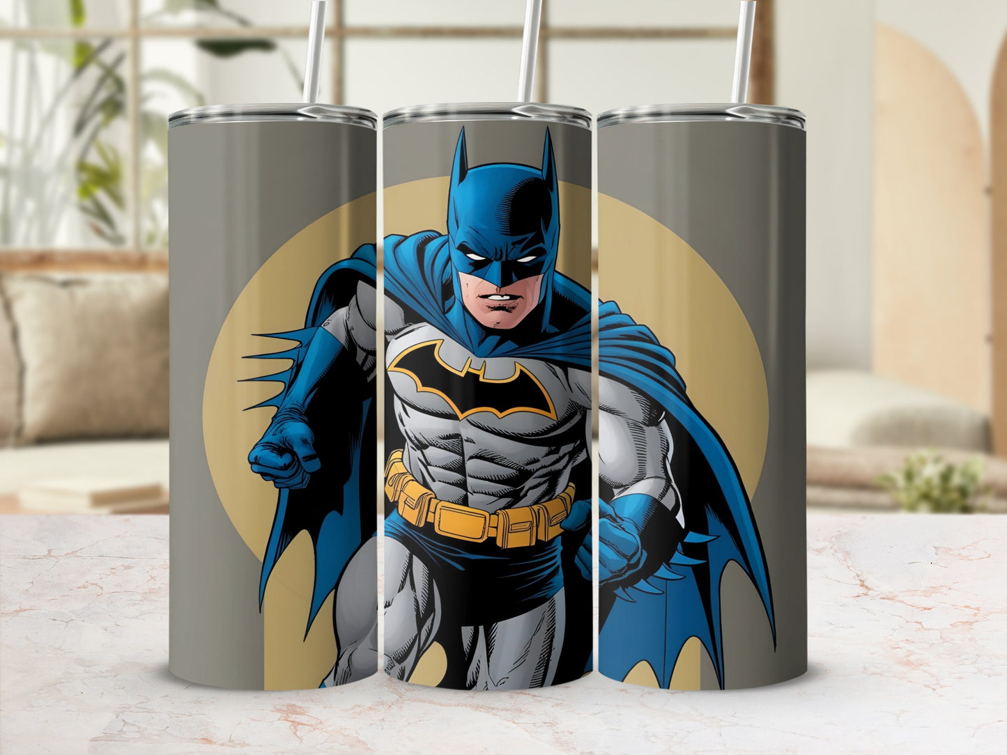 Batman superhero illustration on a gray tumbler with yellow accents.