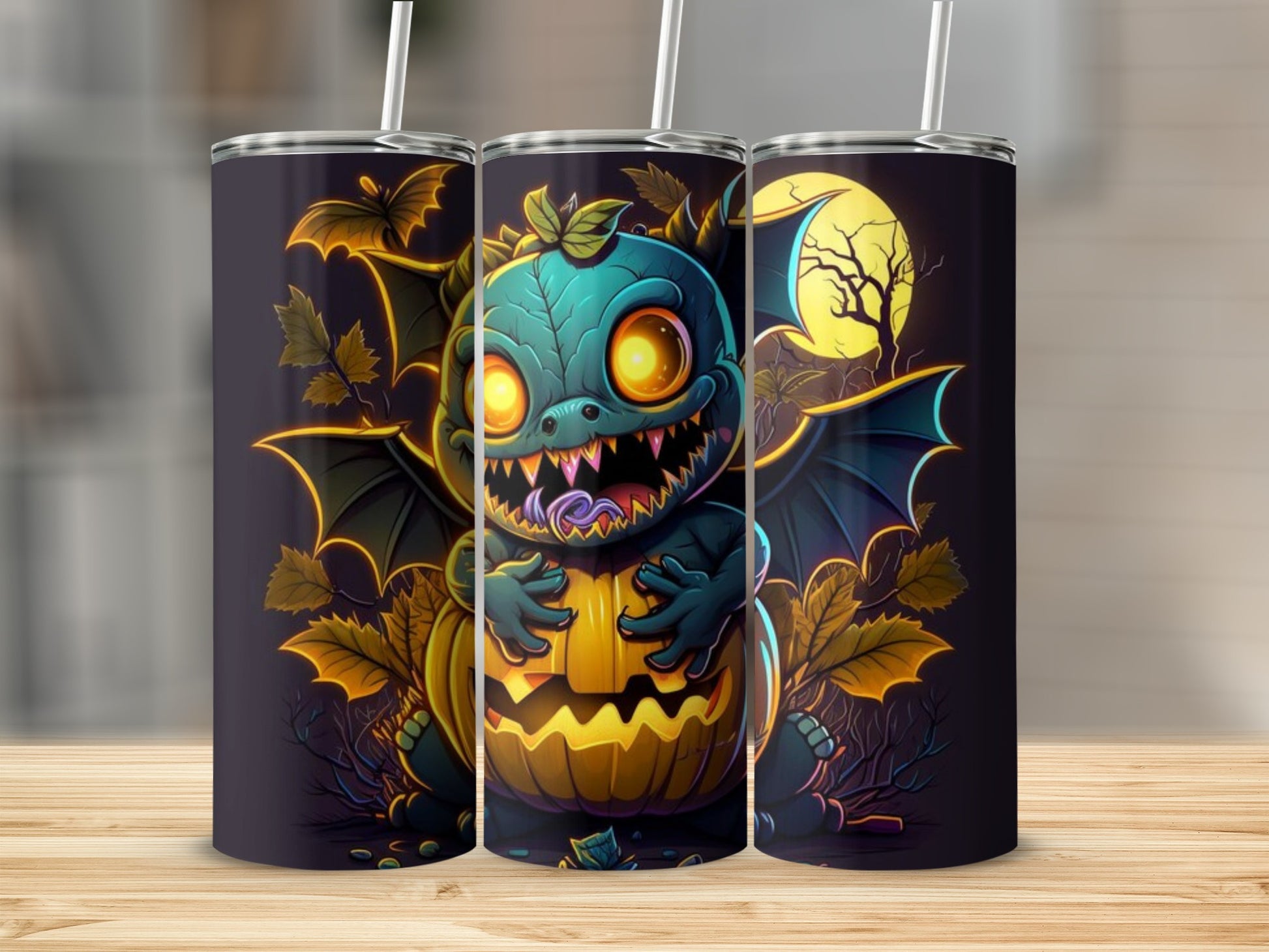Three tumblers with a Halloween design featuring a teal dragon holding a jack-o'-lantern.