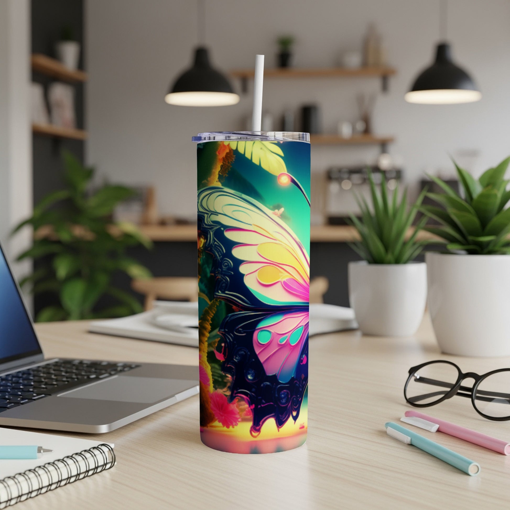 Colorful butterfly design on a white skinny tumbler with straw.