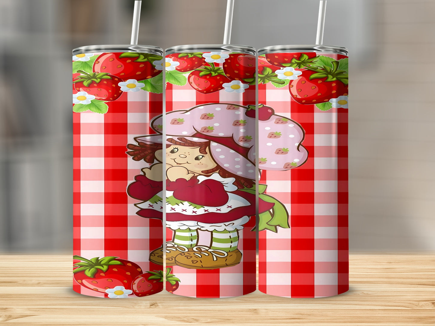 Strawberry Shortcake character on a red and white checkered pattern tumbler.
