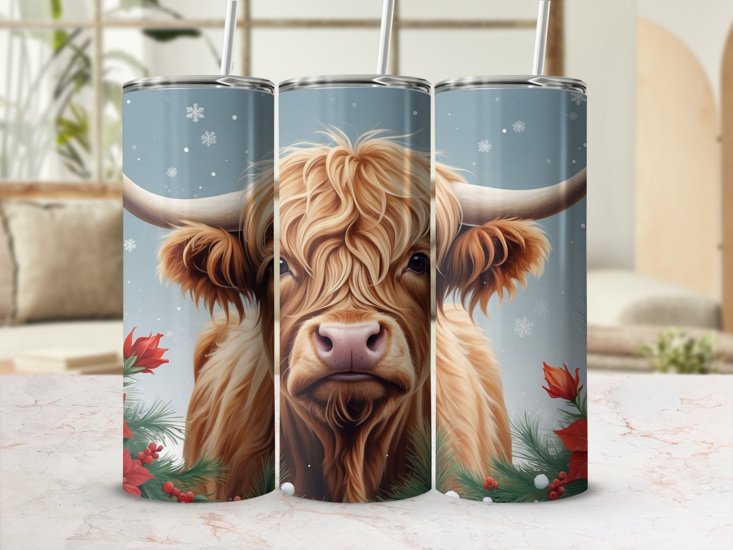 Highland cow with snowflakes and poinsettias on a blue tumbler.