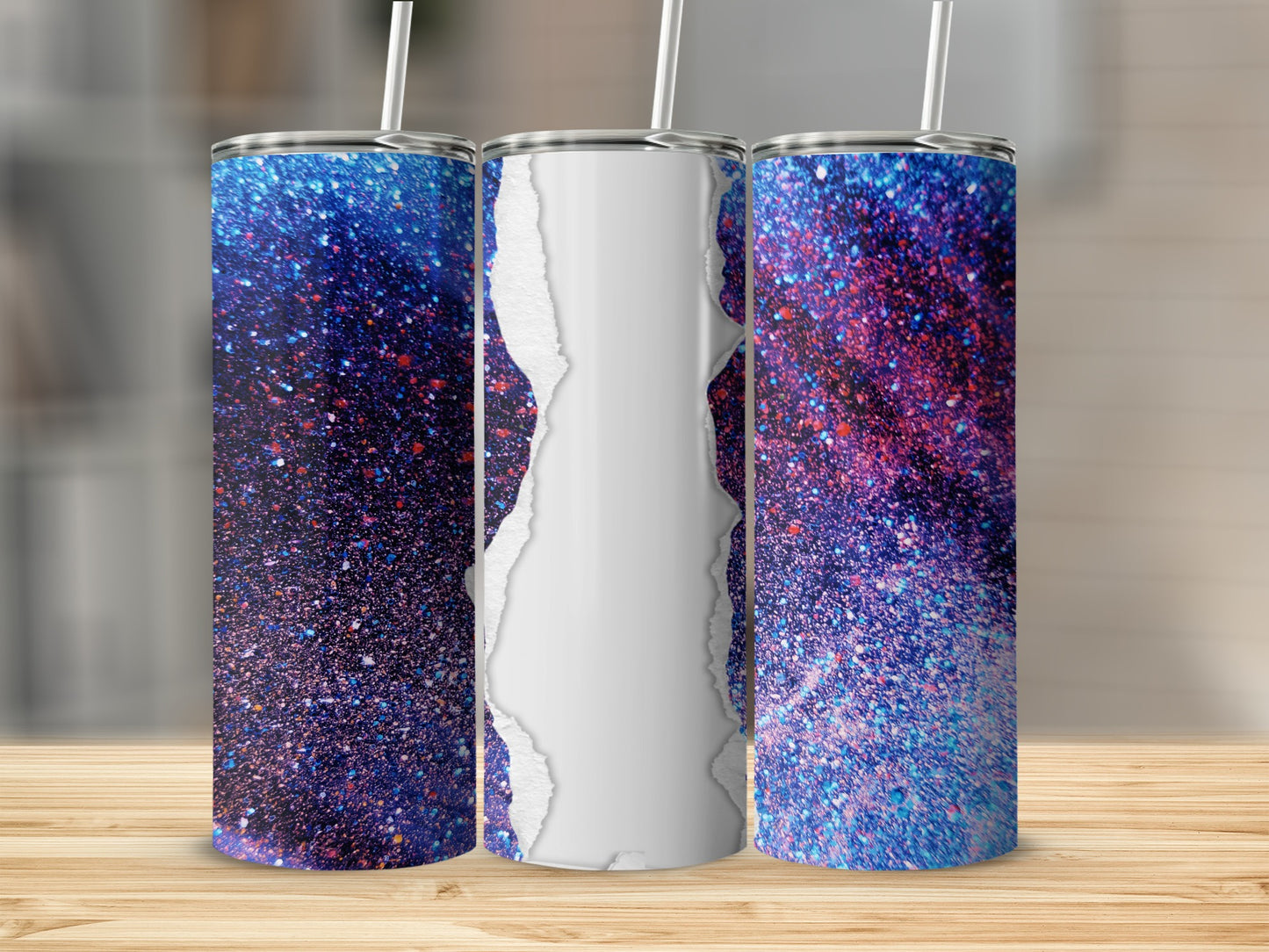 Three tumblers with glittery blue and pink cosmic design and ripped paper effect.
