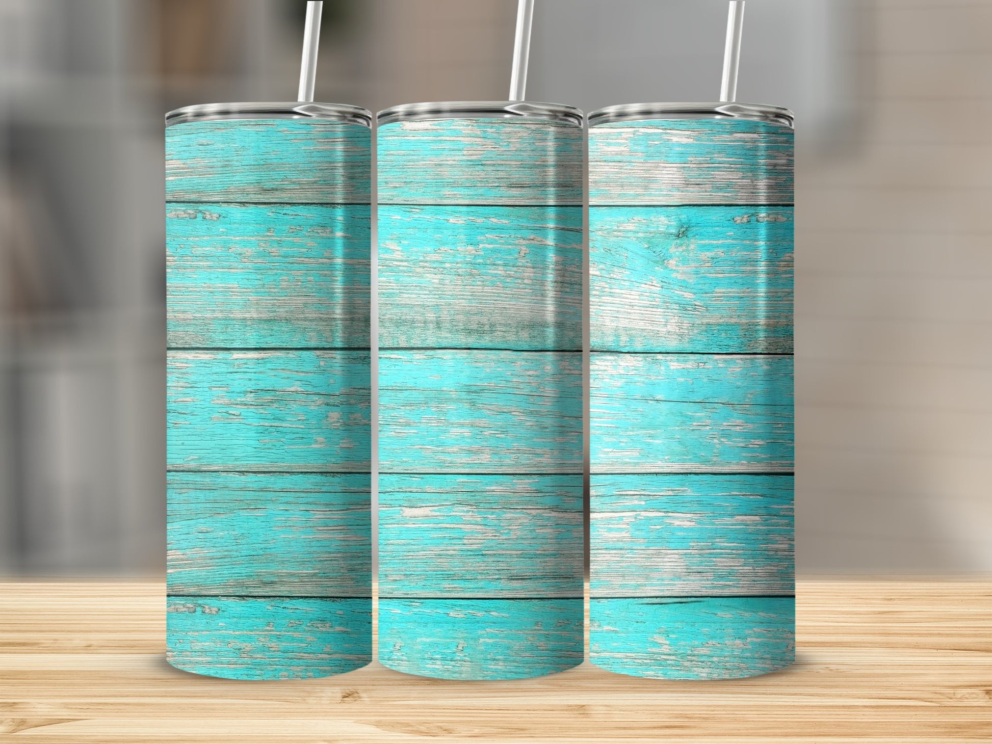Three tumblers with a distressed aqua wood grain pattern stand side by side.