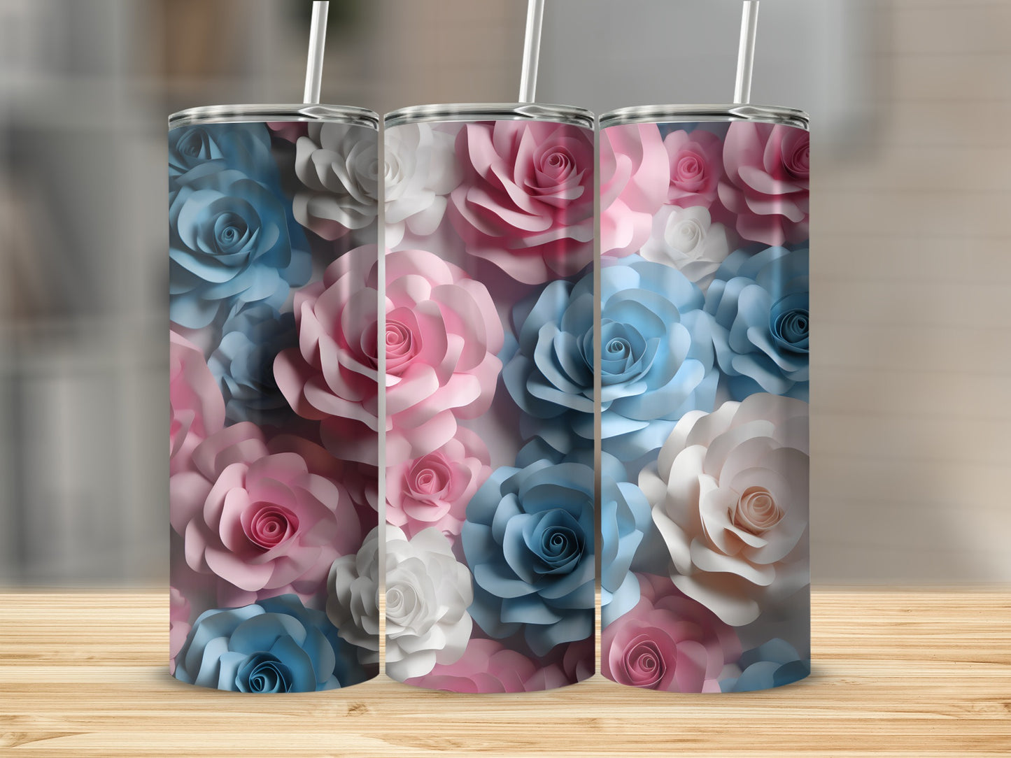 Three tumblers with a floral pattern of pink, blue, and white roses.