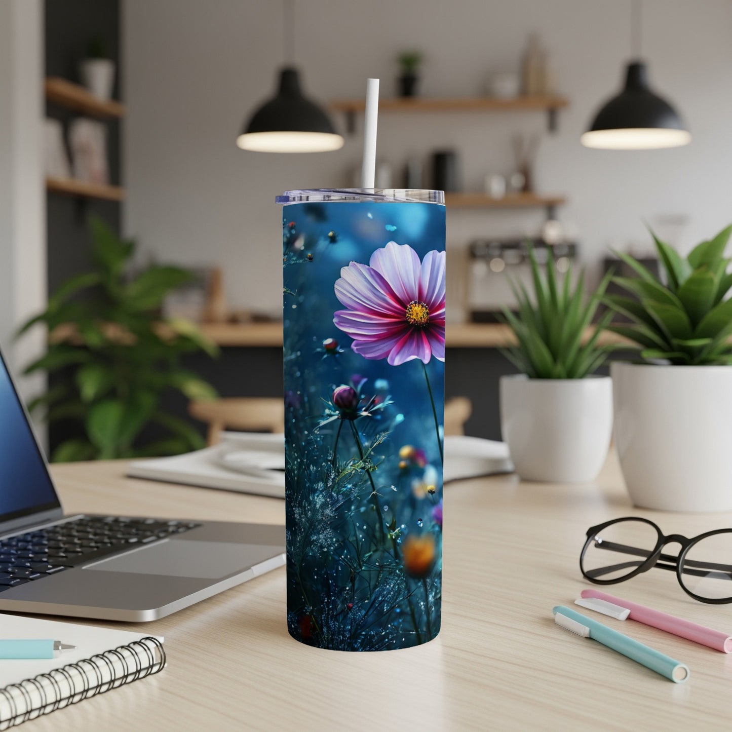 Tall tumbler with a vibrant pink and purple flower on a dark blue, dewy background.