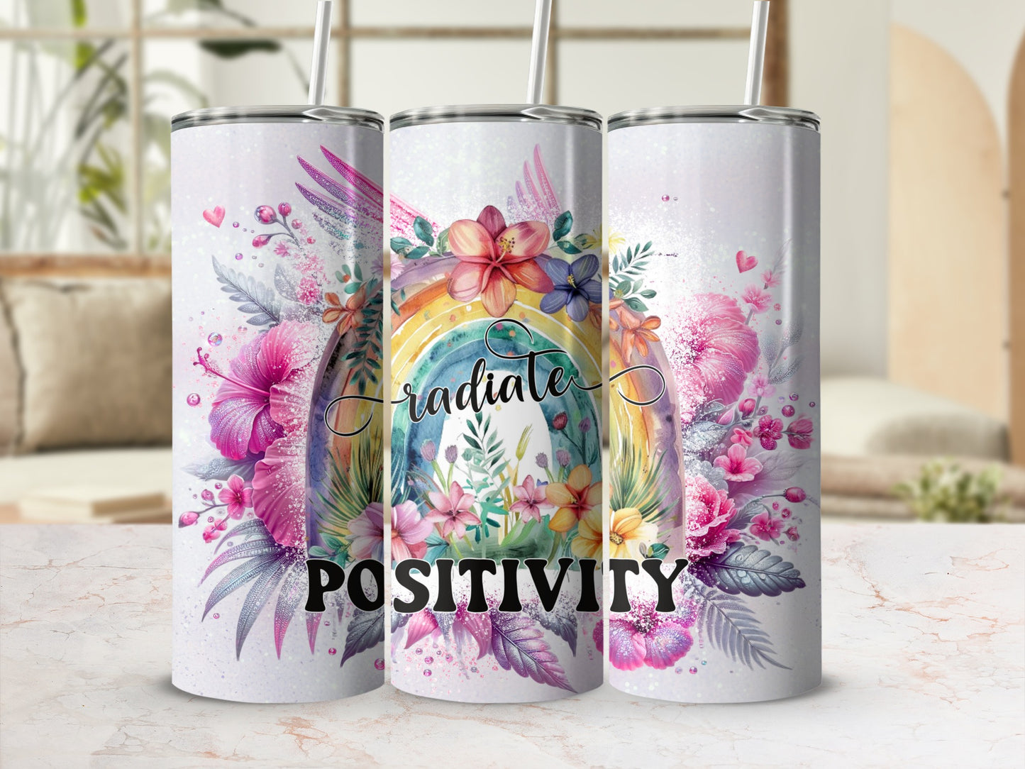 Three tumblers featuring a rainbow, flowers, and "radiate positivity" text.
