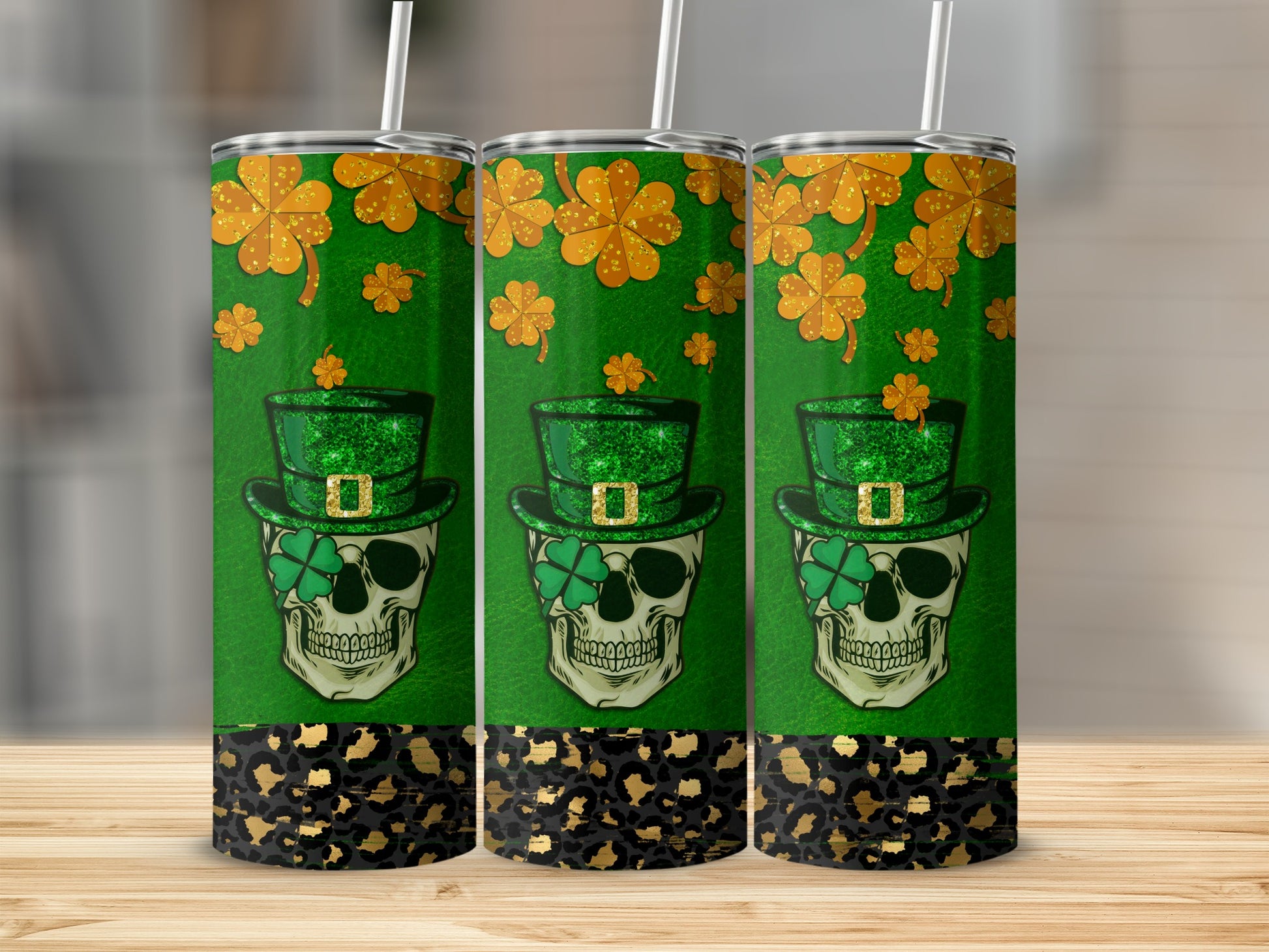 Three green tumblers with skull, shamrocks, and leopard print.