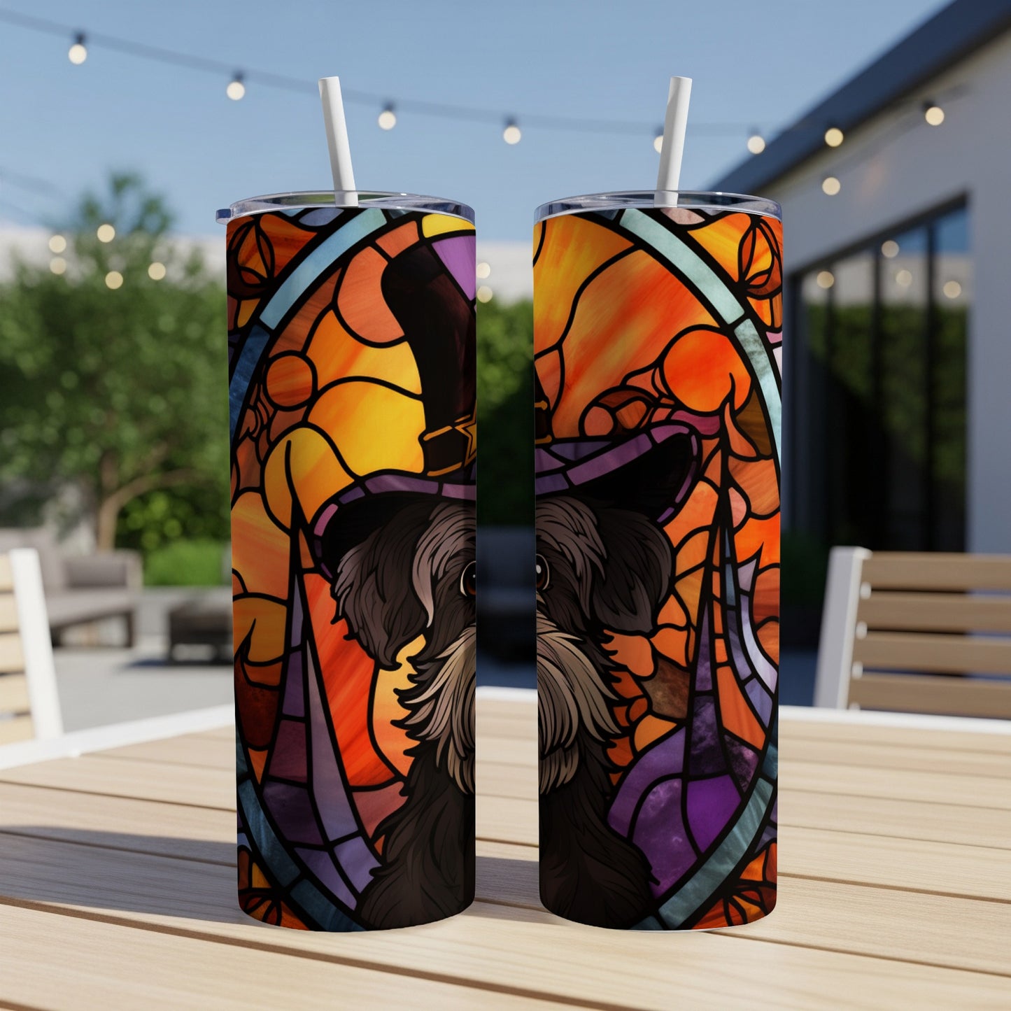 Two tumblers with stained-glass dog design and witch hat.