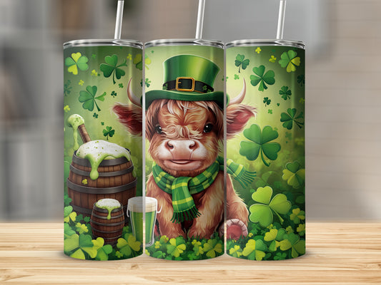 Highland cow wearing a leprechaun hat and scarf, surrounded by shamrocks and a beer barrel.