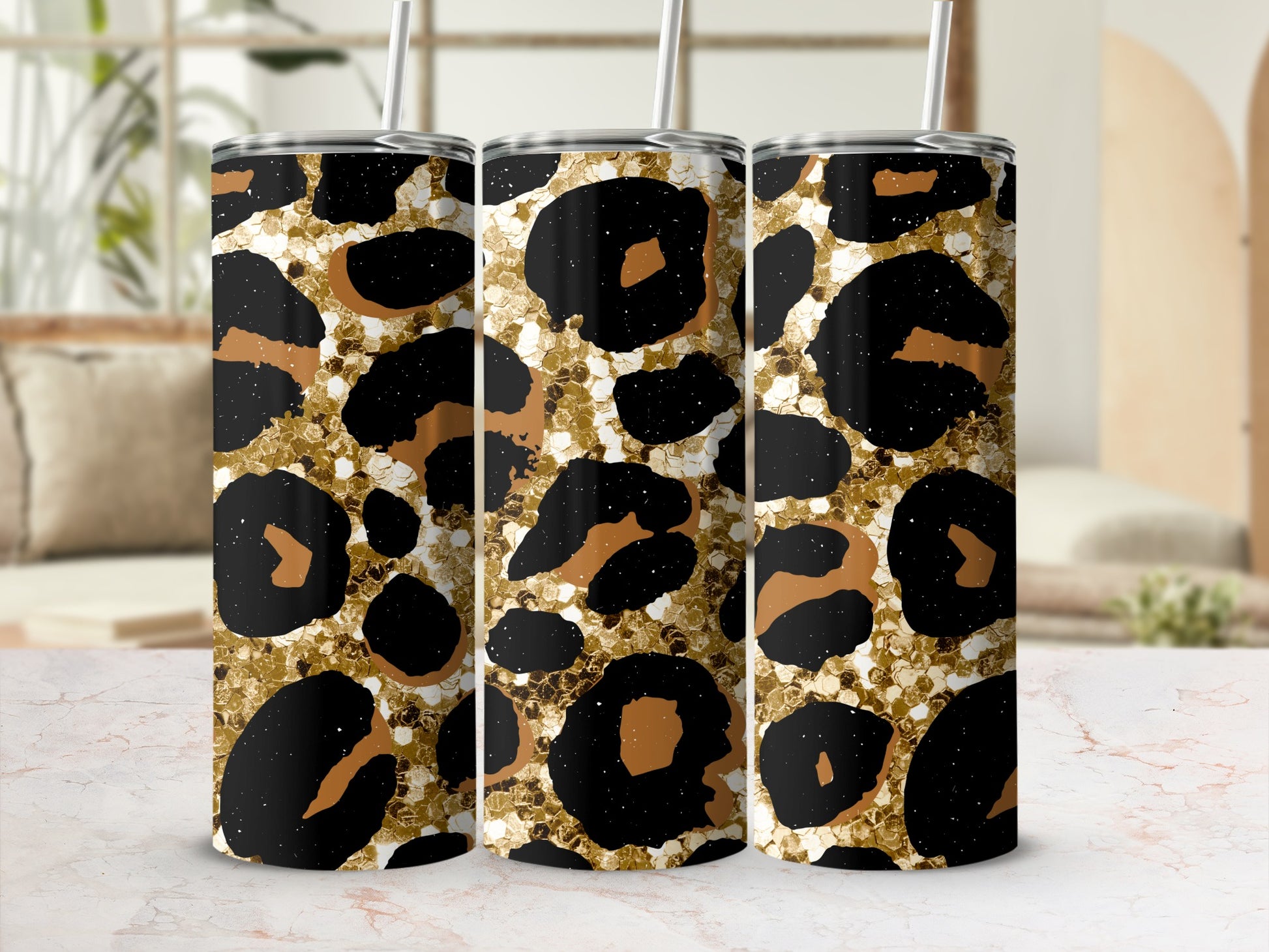 Three tumblers with a gold and black leopard print pattern.