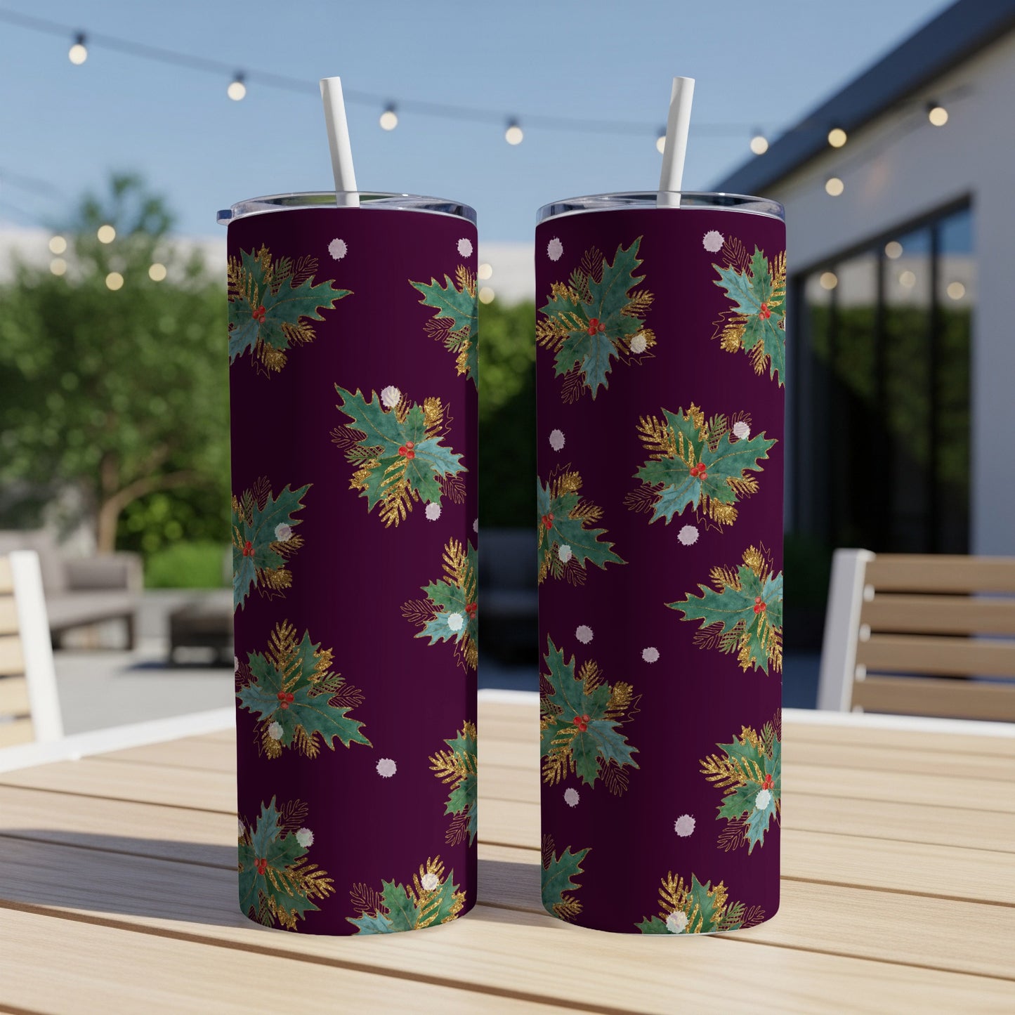 Two tumblers with a burgundy background and a green holly leaf pattern.