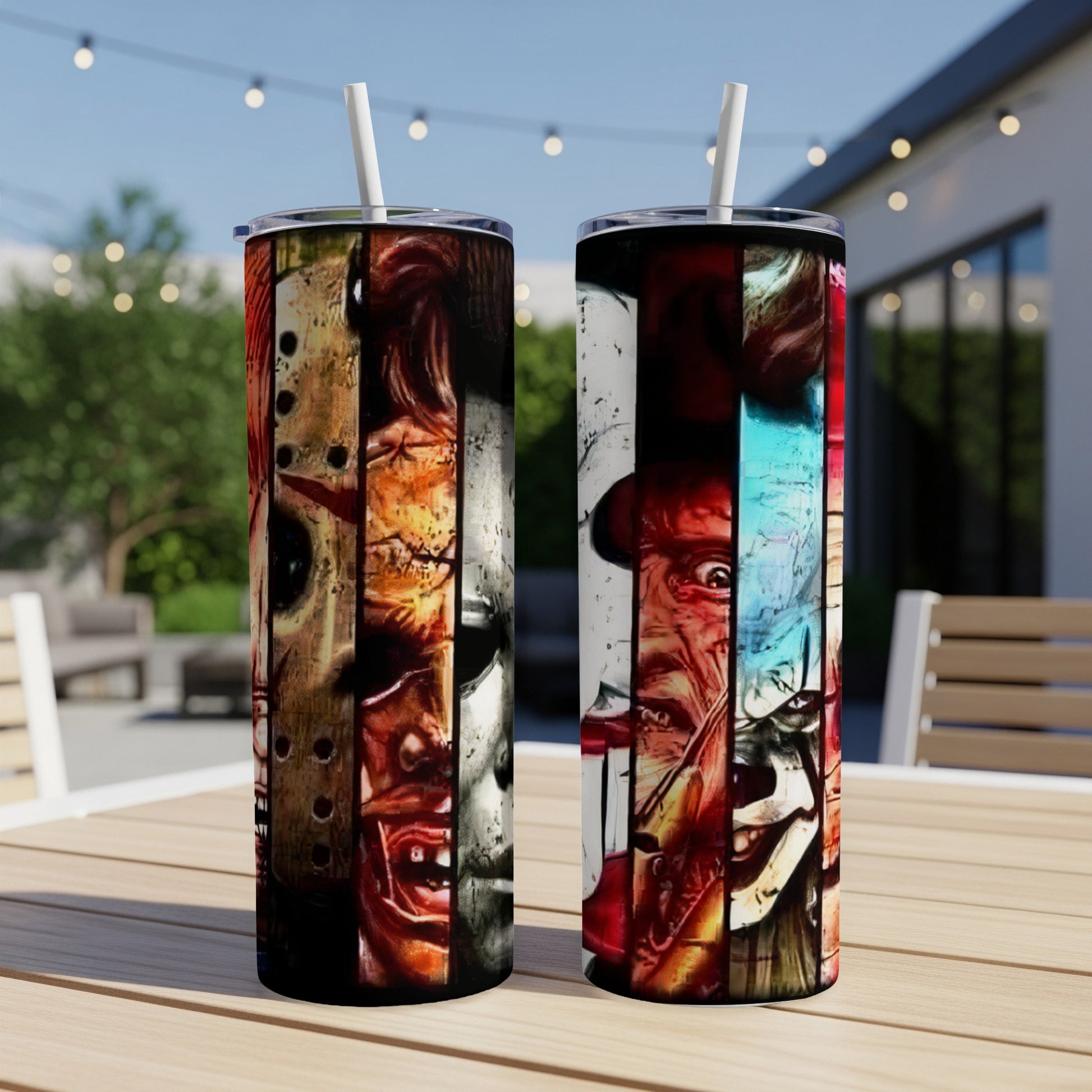 Two tall tumblers with collaged horror movie characters on a wooden table.