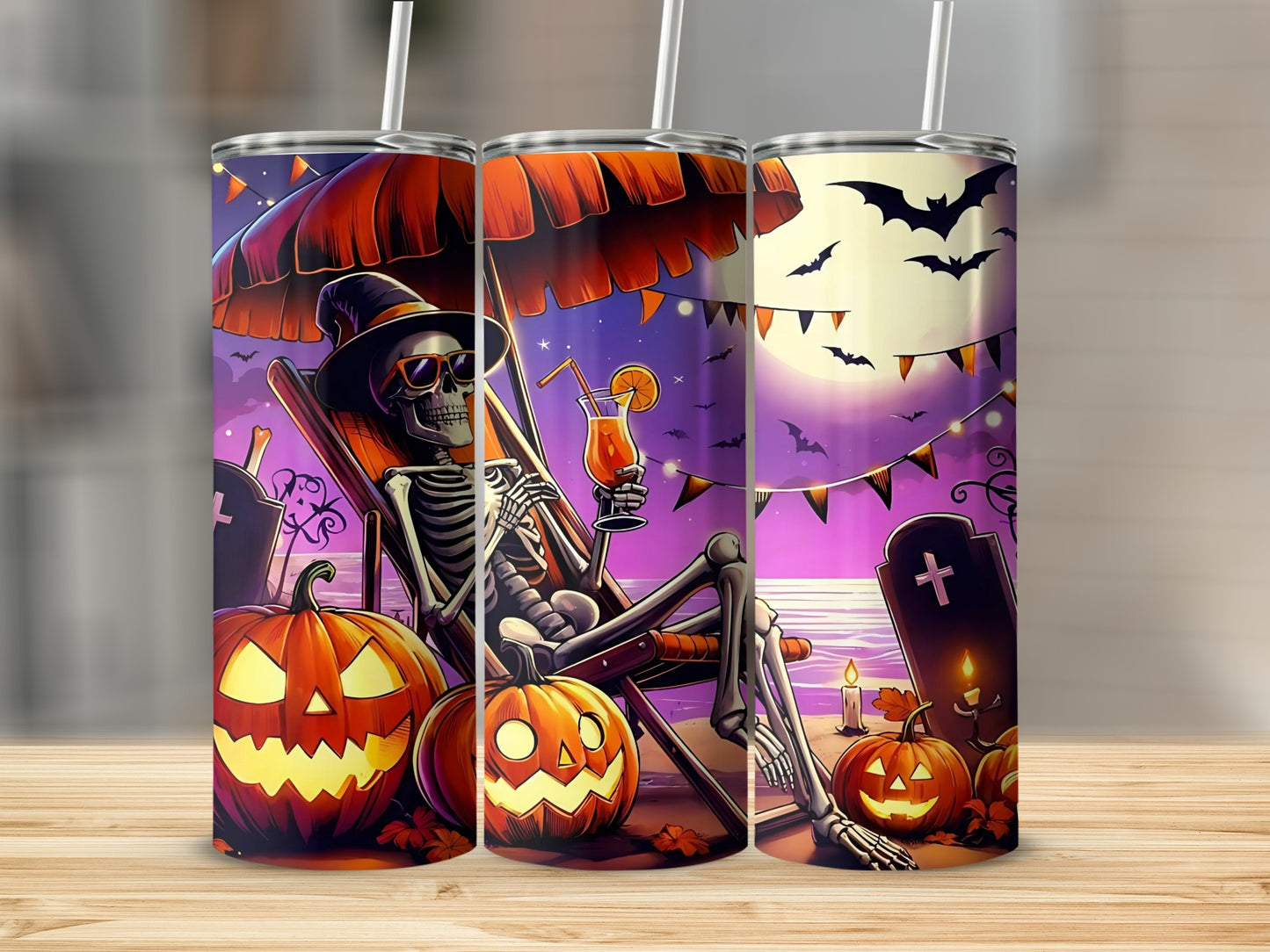 Halloween tumblers with skeleton, pumpkins, bats, moon, and beach scene.