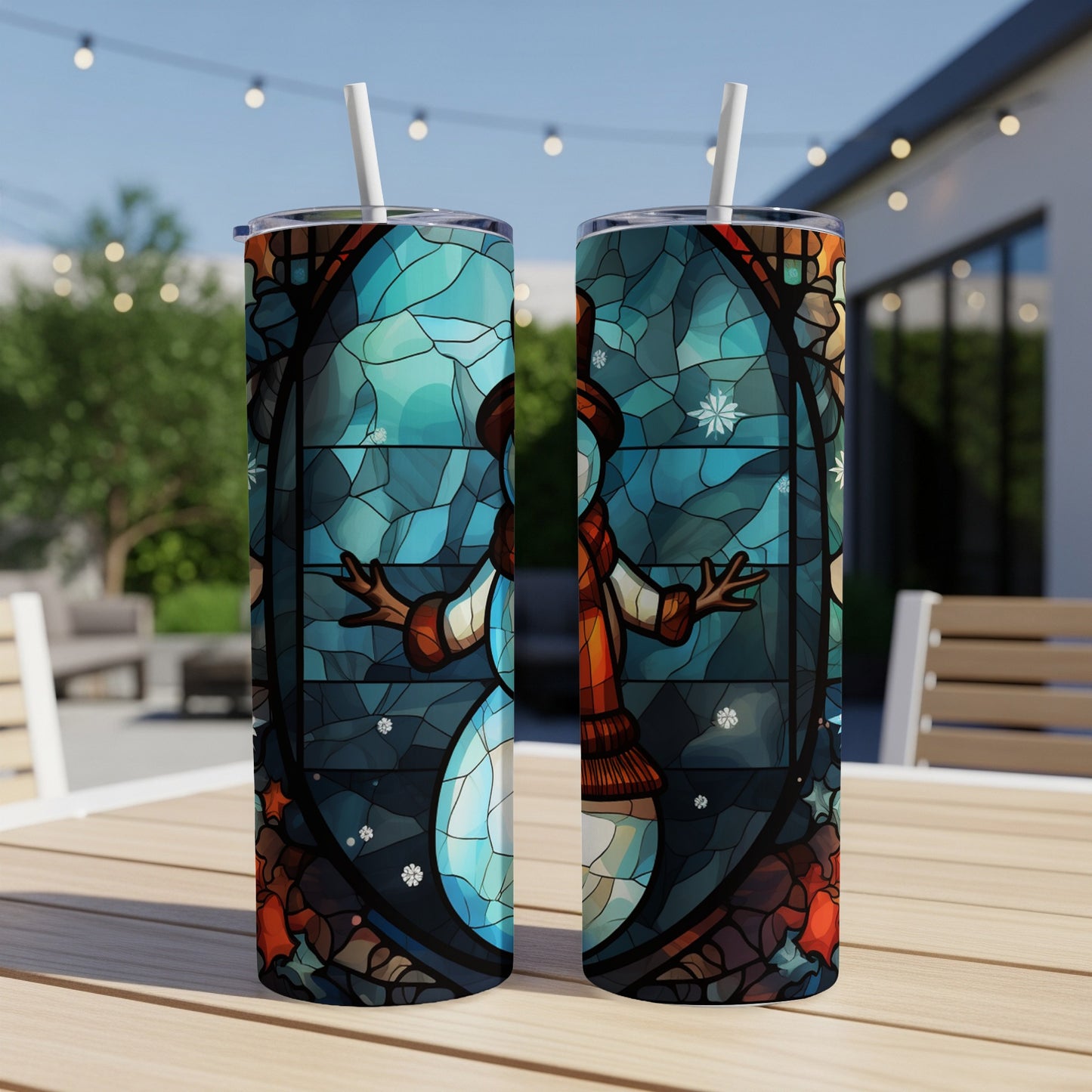 Two tumblers featuring a stained-glass snowman design with snowflakes.