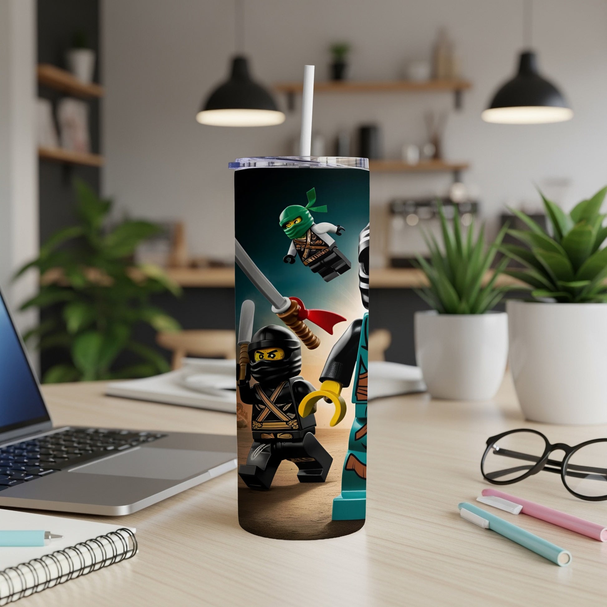 Ninjago characters on a green and black tumbler with a white straw.