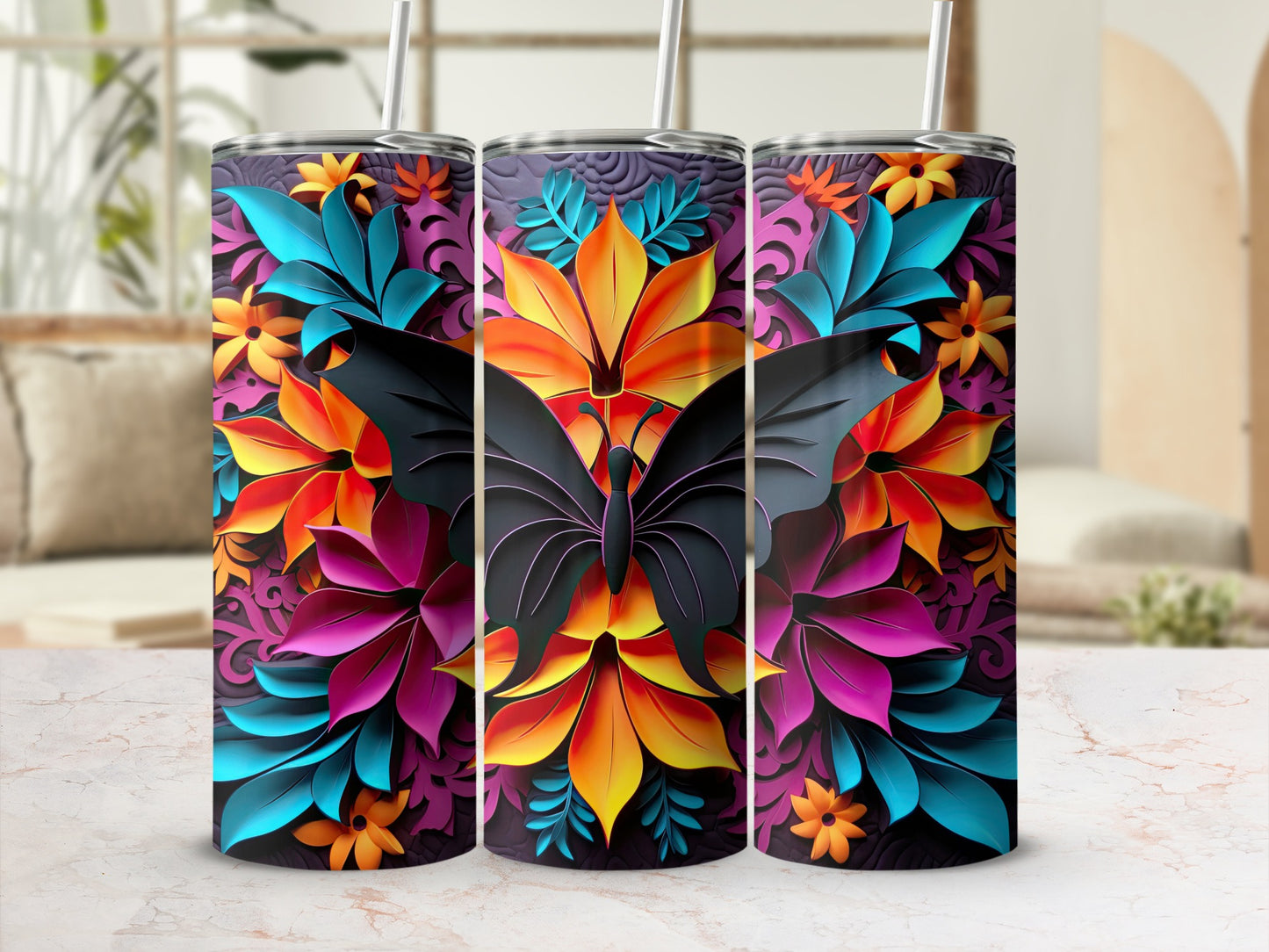 Three tumblers with a dark butterfly and vibrant floral pattern.