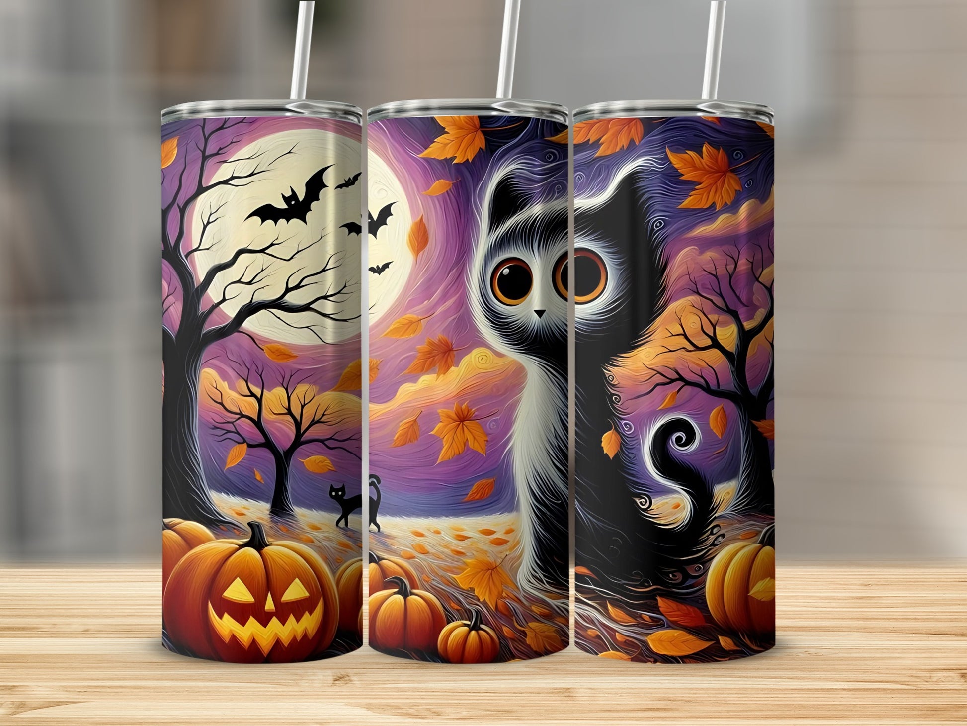 Three tumblers with a Halloween theme featuring a black cat, pumpkins, bats, and autumn leaves.