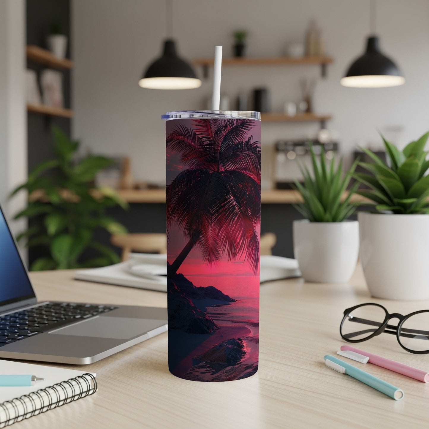 Palm tree and sunset on a beach scene printed on a white tumbler.